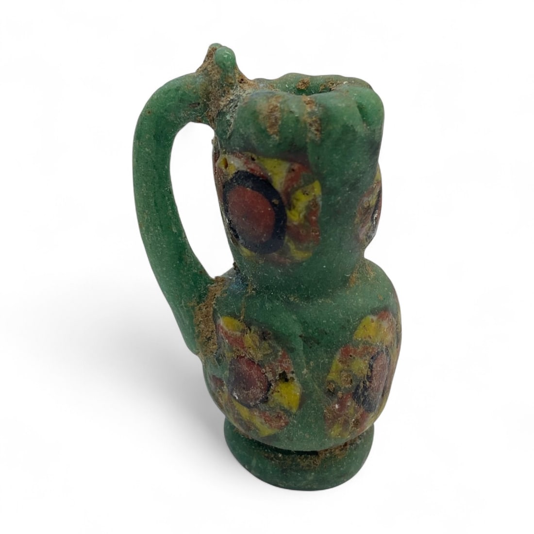 Medieval Islamic Egyptian Polychrome "Evil Eye" Miniature Jug, c. 10th-12th Century CE, 21g: A rare and visually striking miniature jug from medieval Islamic Egypt, dating to the 10th-12th century CE. Weighing 21 grams and standing 4 cm (1.57 inches) tall, this petite vessel is rendered in op