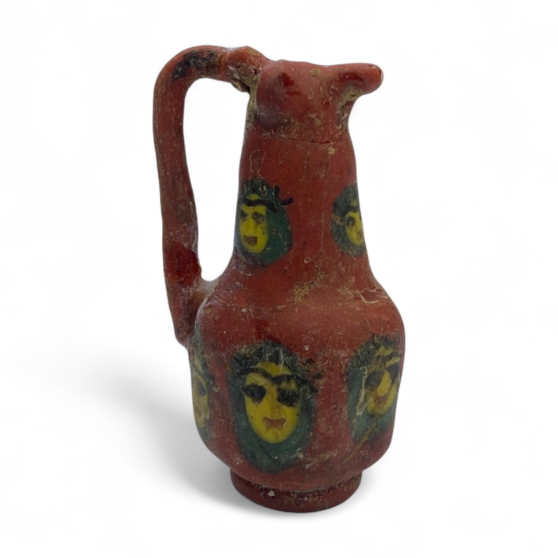 Ancient Medieval Islamic Egyptian Portrait Glass Miniature Jug, c. 10th-12th Century CE, 27g: This rare and captivating miniature jug, adorned with expressive portrait medallions, is a superb example of Islamic Egyptian glasswork from the Fatimid period, c. 10th-12th century CE. Weighing 27 gr