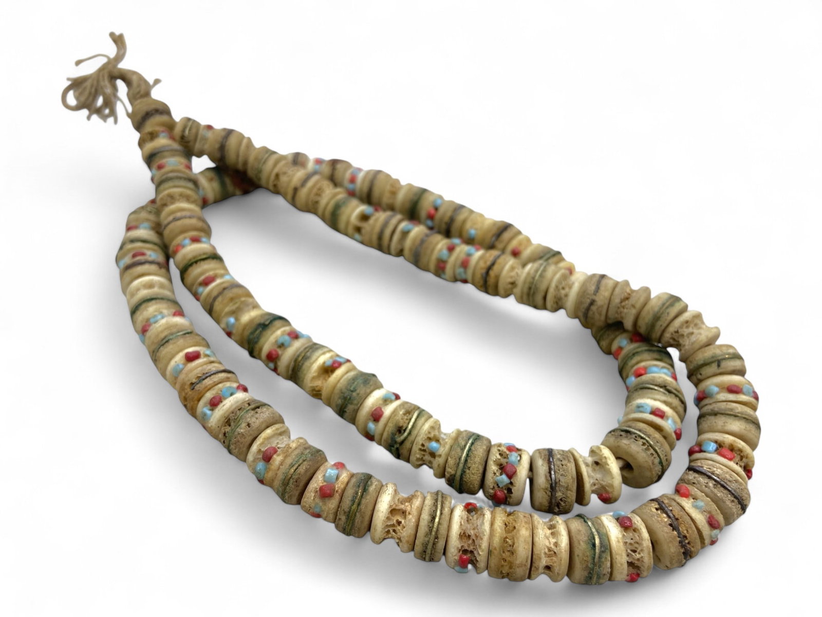 Antique Tibetan Yak Bone Spacer Beads Strand with Inlay Dots, 86g: This long strand features traditional Tibetan yak bone spacer beads, each intricately inlaid with vibrant red coral, turquoise, and occasionally lapis-colored accents. Weighing 86 grams, the necklace