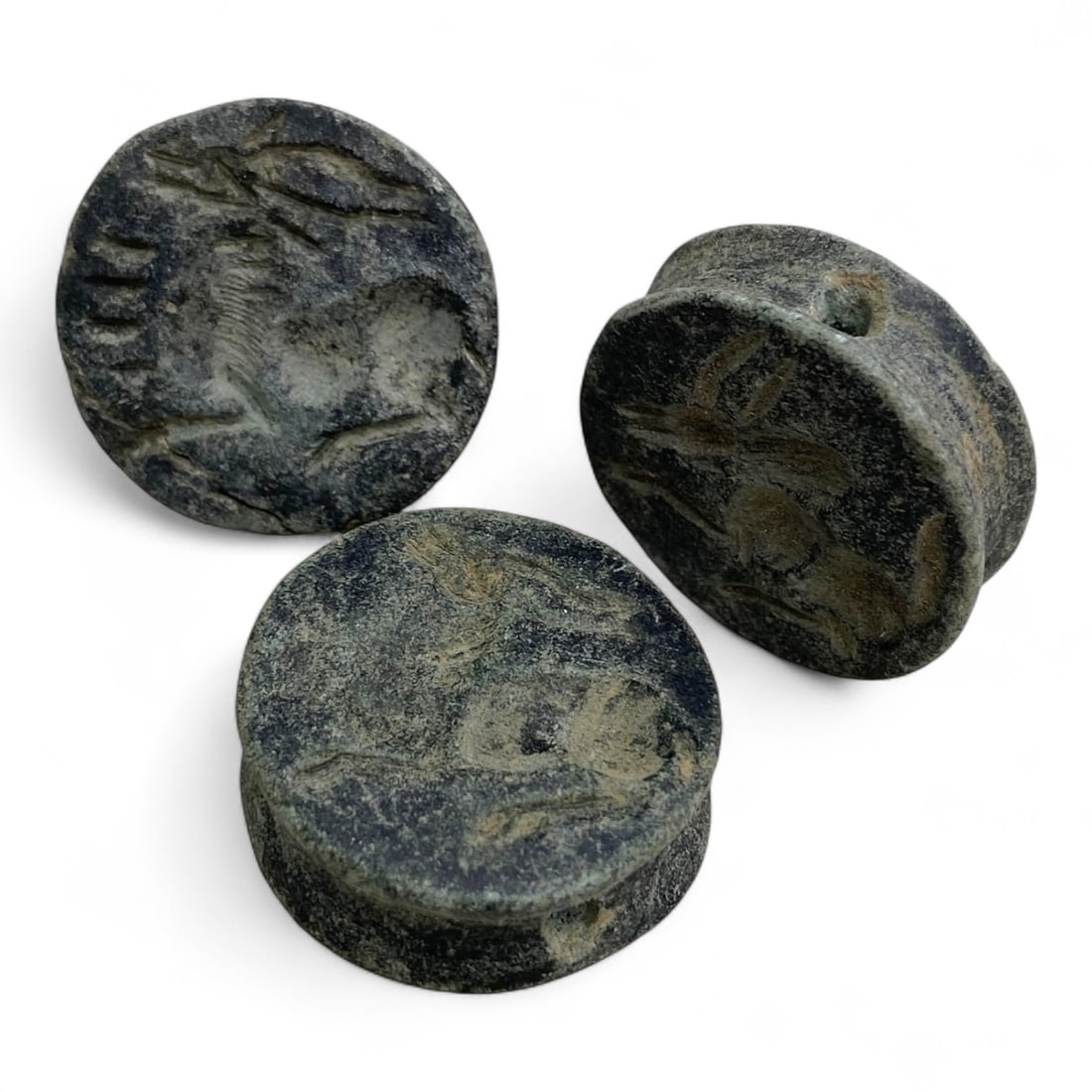 Ancient Near Eastern Zoomorphic Double-Convex Stone Seals, c. 3rd-2nd Millennium BCE, 41g: This captivating set of three ancient zoomorphic seals showcases the artistry and symbolic language of early civilizations in the Near East. Each stone seal, double-convex in form and measuring approx
