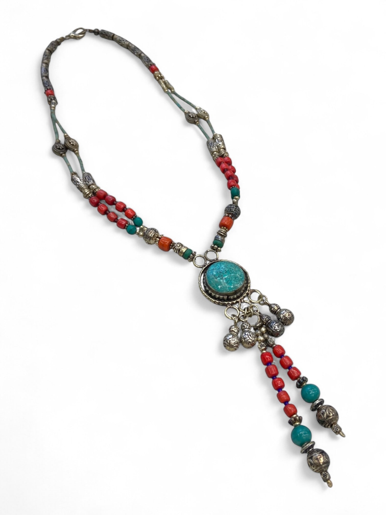 Vintage Himalayan Tribal Turquoise Coral Silver Dangle Pendant Necklace, mid-20th Century, 53g: This elegant vintage Himalayan necklace, likely originating from Nepal or Tibet in the mid-20th century, displays a harmonious blend of cultural symbolism and skilled craftsmanship. At its center rest