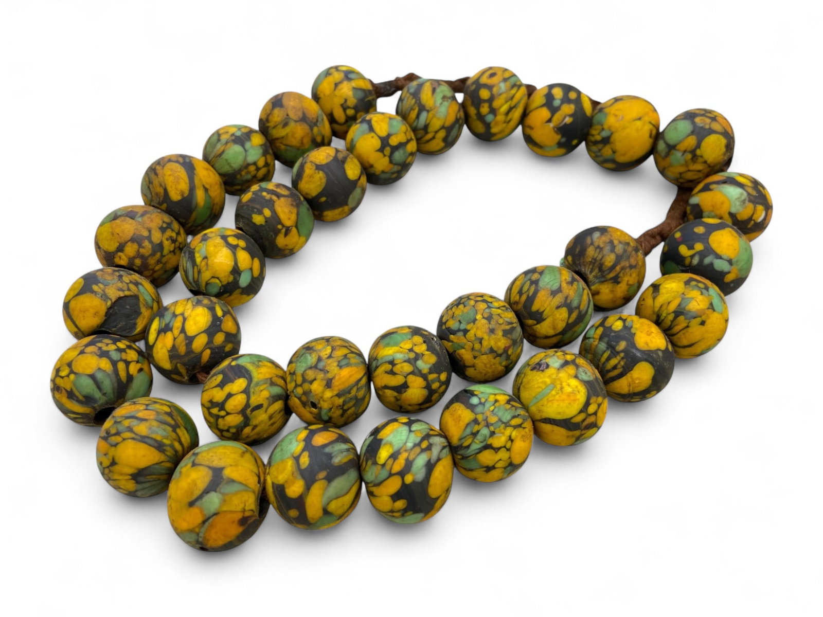 Antique Venetian Millefiori Polychrome Trade Bead Strand, c. Late 19th Century - 304g: This remarkable strand of antique Venetian millefiori beads offers a vivid window into the global artistry and commerce of the late 19th century. Crafted using Murano's centuries-old glassworking trad