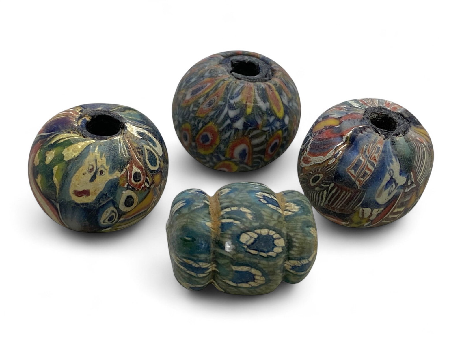 Ancient Medieval Islamic Egyptian Mosaic Glass Beads Collection, c. 10th-15th Century CE, 38g: This exquisite group of four mosaic glass beads hails from Islamic Egypt during the height of medieval glass artistry, spanning the Fatimid to Mamluk dynasties (c. 10th-15th century CE). Created throu