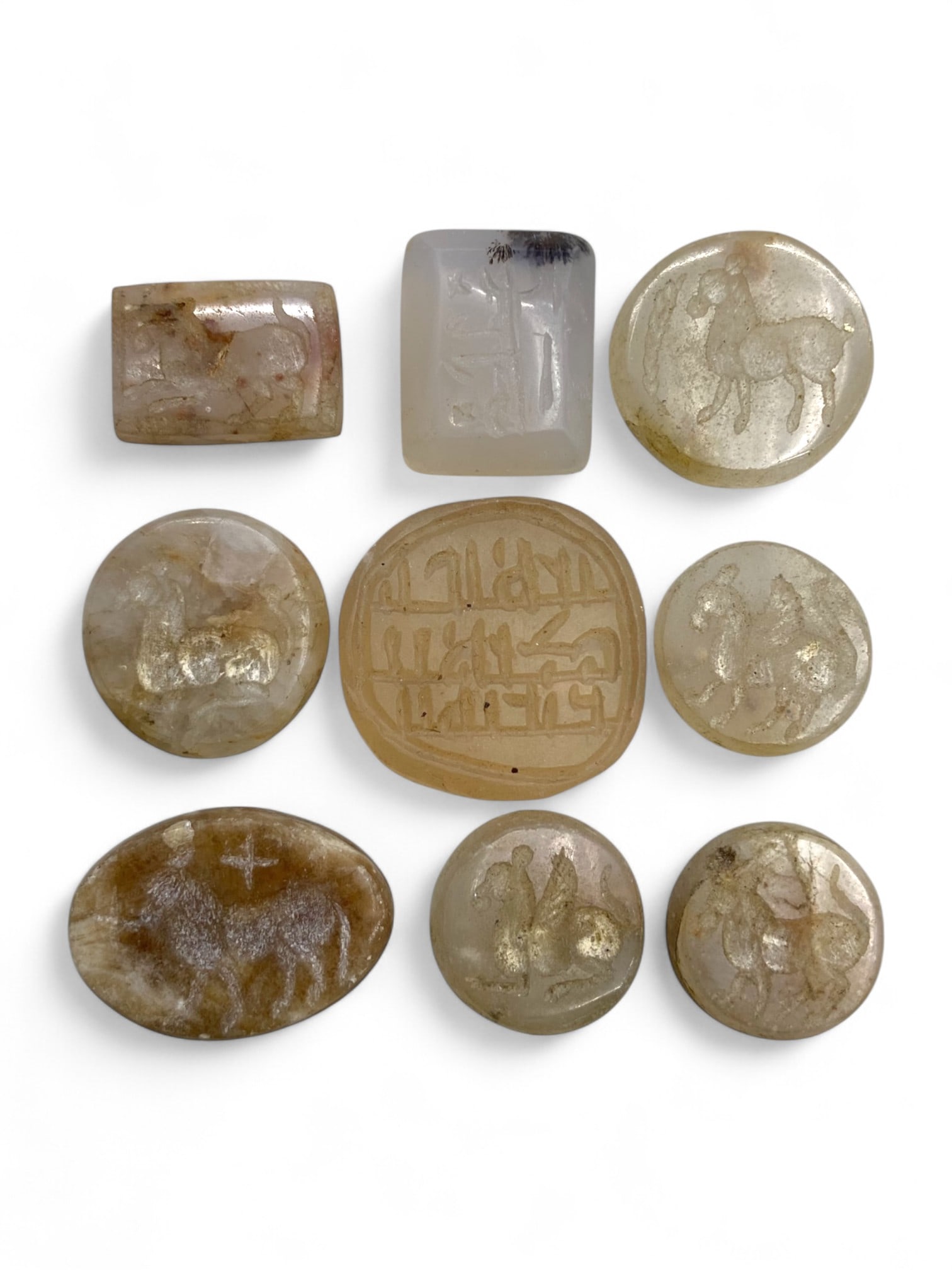 Ancient Medieval Islamic and Central Asian Chalcedony Seal Collection, c. 7th-10th Century CE, 35g: This distinguished collection of nine engraved chalcedony and quartz seals offers a window into the cultural synthesis of early Islamic and Central Asian artistry from the 7th to 10th century CE. Exec