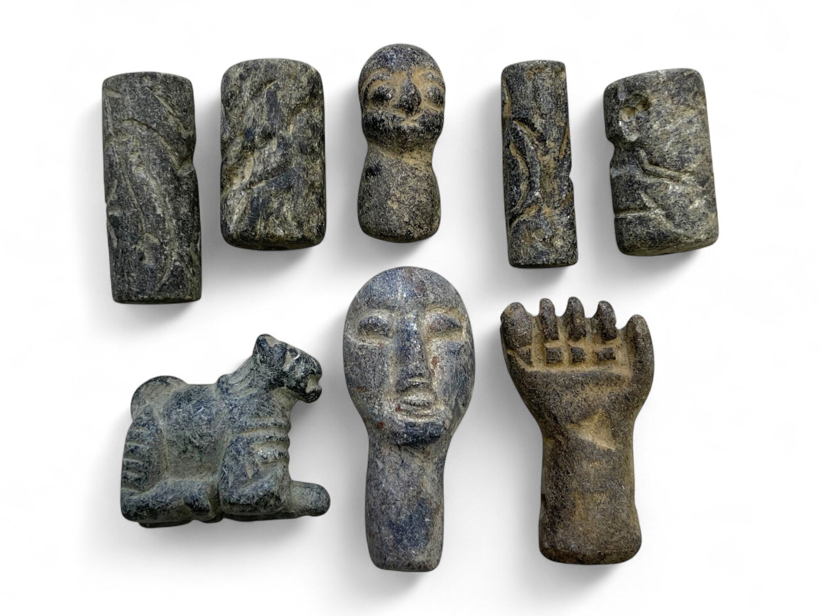 Ancient Indus Valley Steatite Ritual Figures & Amulets, 3rd-2nd Millennium BCE, 62g: A fascinating ensemble of eight carved steatite relics originating from the Indus Valley Civilization or adjacent protohistoric cultures of South Asia, dating circa 2600-1500 BCE. The set comprises cy