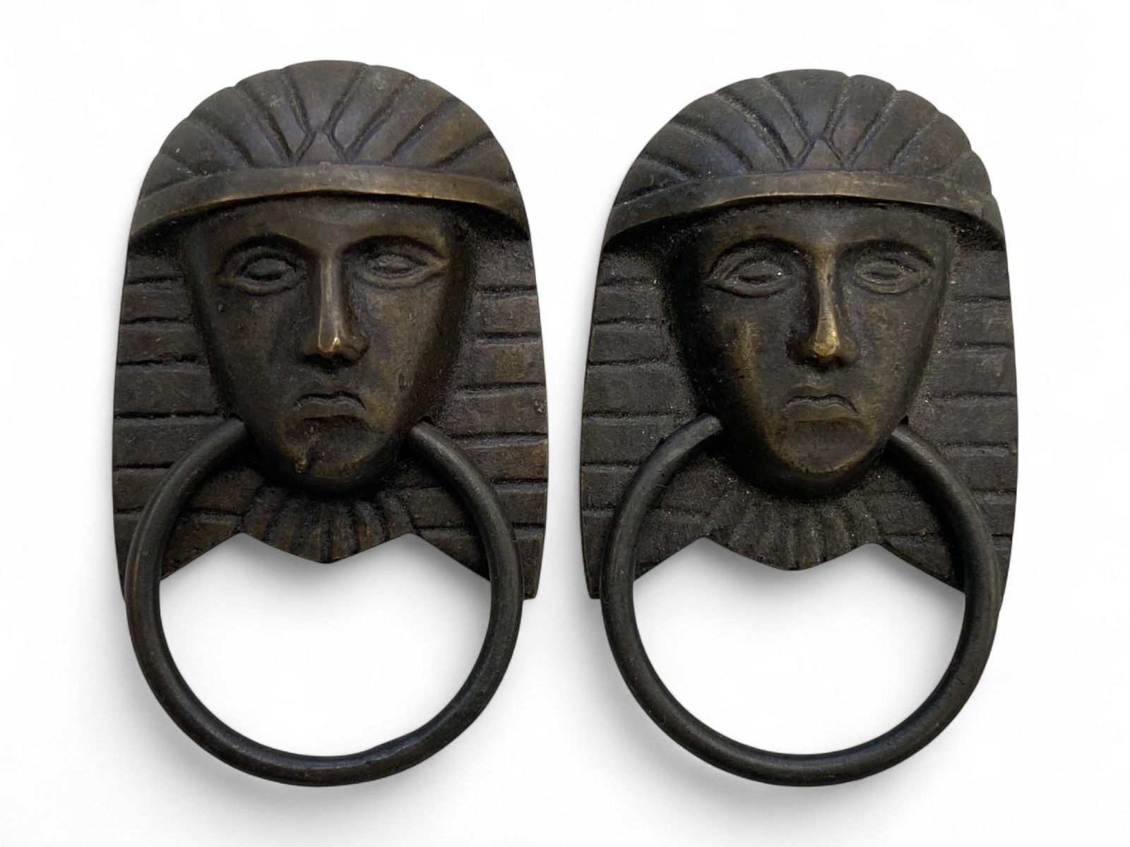 Antique Egyptian Revival Pharaoh Motif Bronze Drawer Pull Pair, c. 19th-20th Century, 85g: This striking pair of drawer pulls captures the mystique and regal iconography of ancient Egypt, revived during the flourishing Egyptian Revival movement of the 19th to early 20th century. Modeled aft