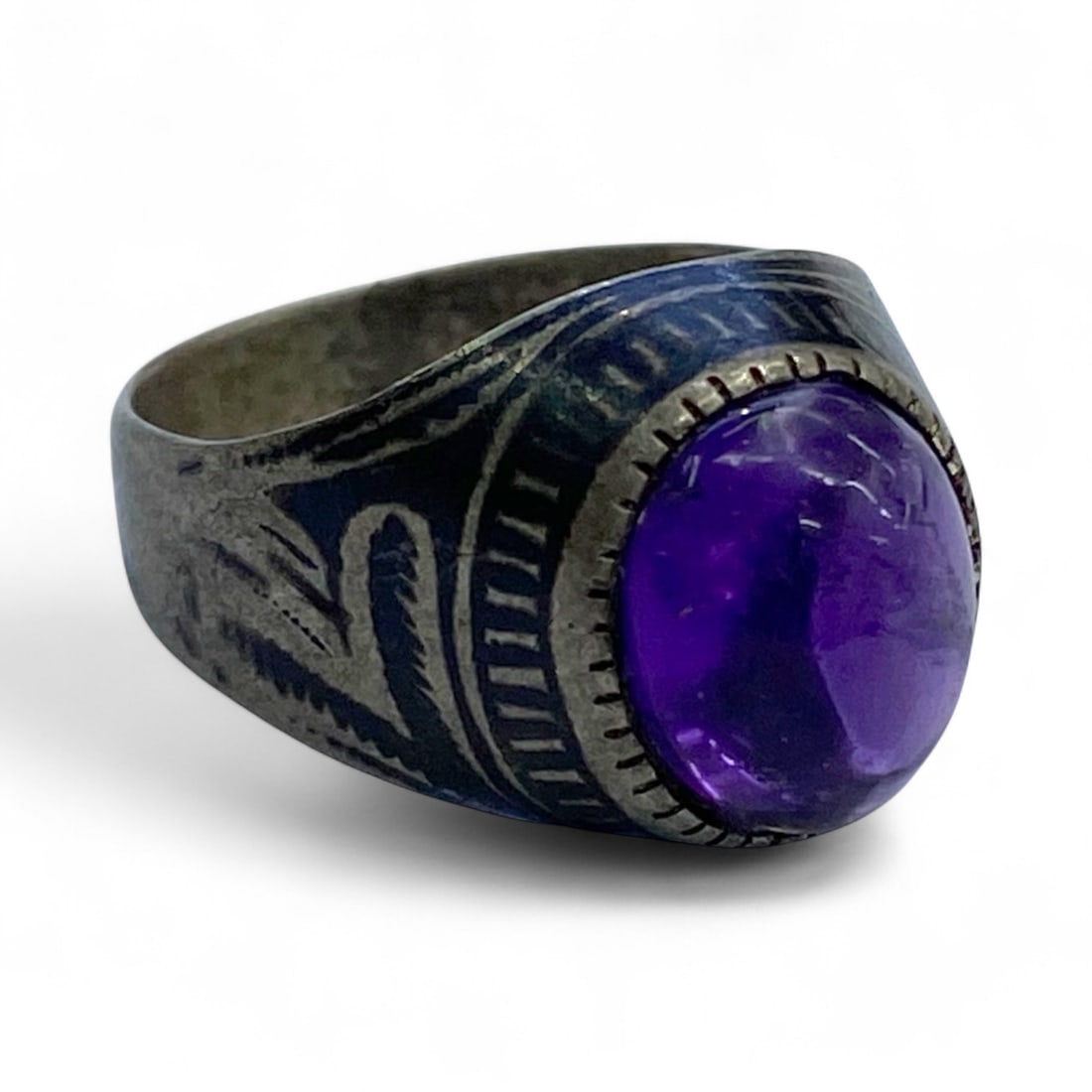 Antique Persian Qajar Silver Engraved Talismanic Ring with Amethyst Stone, c. 19th Century, 4g: This antique silver ring hails from the late Qajar period of Persia, a time when artistry and mysticism intertwined to create deeply meaningful personal adornments. The piece features an oval bezel-se