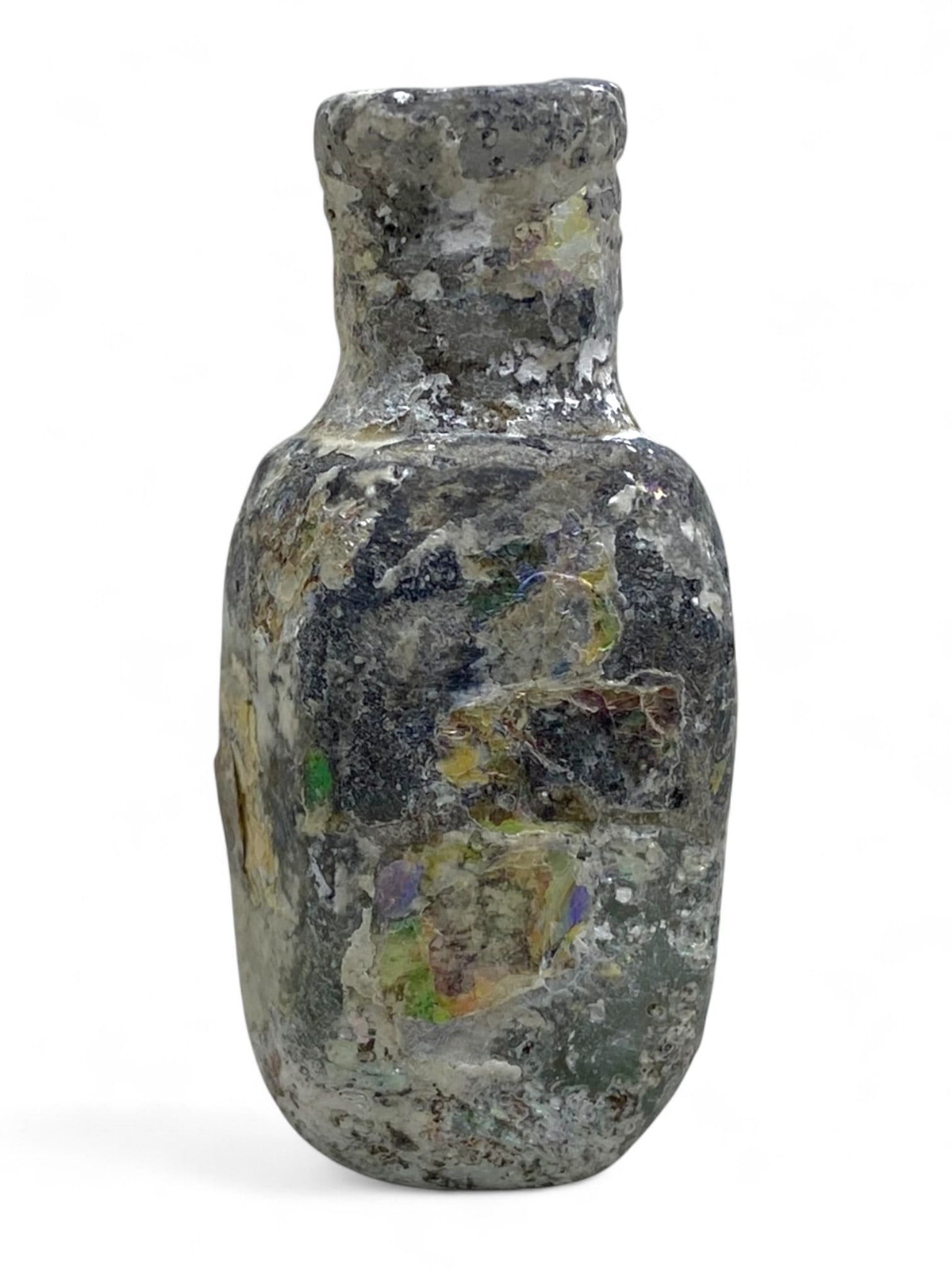 Ancient Roman Cylindrical Glass Unguentarium Vessel, c. 1st-3rd Century CE, 25g: This compact and beautifully weathered Roman glass unguentarium, dating from the 1st to 3rd century CE, offers a rare glimpse into the personal care rituals of antiquity. Standing approximately 5 cm i