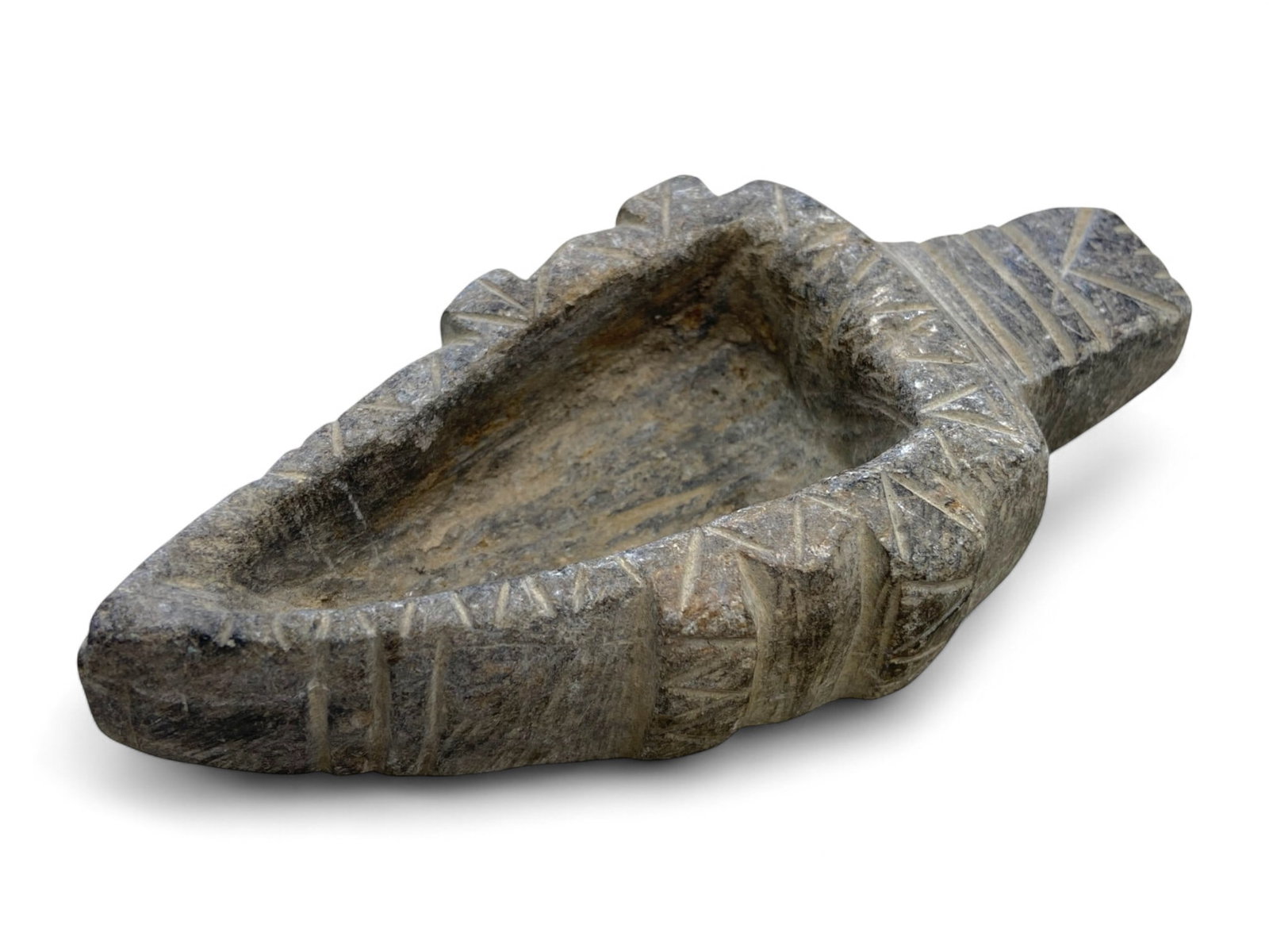 Ancient Near Eastern Carved Steatite Oil Lamp Incised Geometric Motifs, 1st Millennium BCE, 217g: This elegant triangular oil lamp, meticulously carved from a single piece of steatite, dates to the 1st millennium BCE and originates from the culturally rich regions of the ancient Near East, where s
