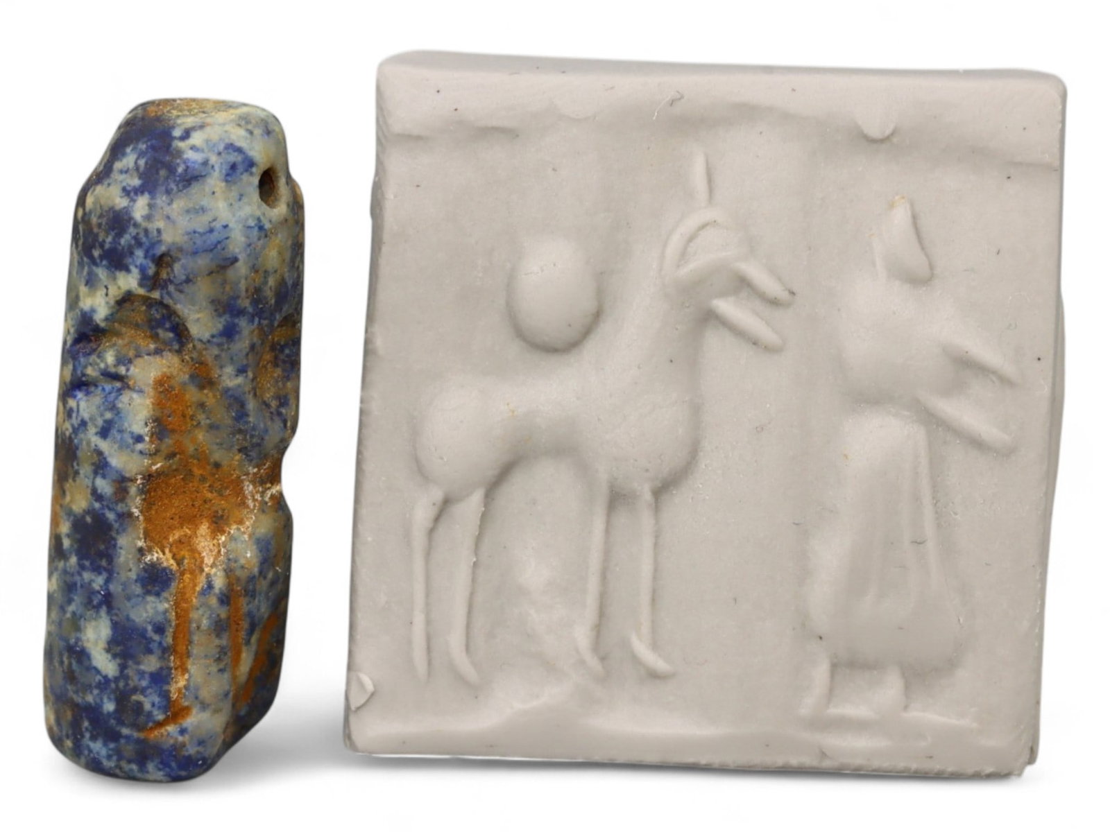 Ancient Akkadian High-Relief Animal and Figure Motif Lapis Lazuli Cylinder Seal, c. 2350-2150 BCE,: This rare lapis lazuli cylinder seal, dating to the Akkadian period c. 2350-2150 BCE, captures the artistic and symbolic sophistication of the world's first empire. Lapis lazuli, imported from Afghani