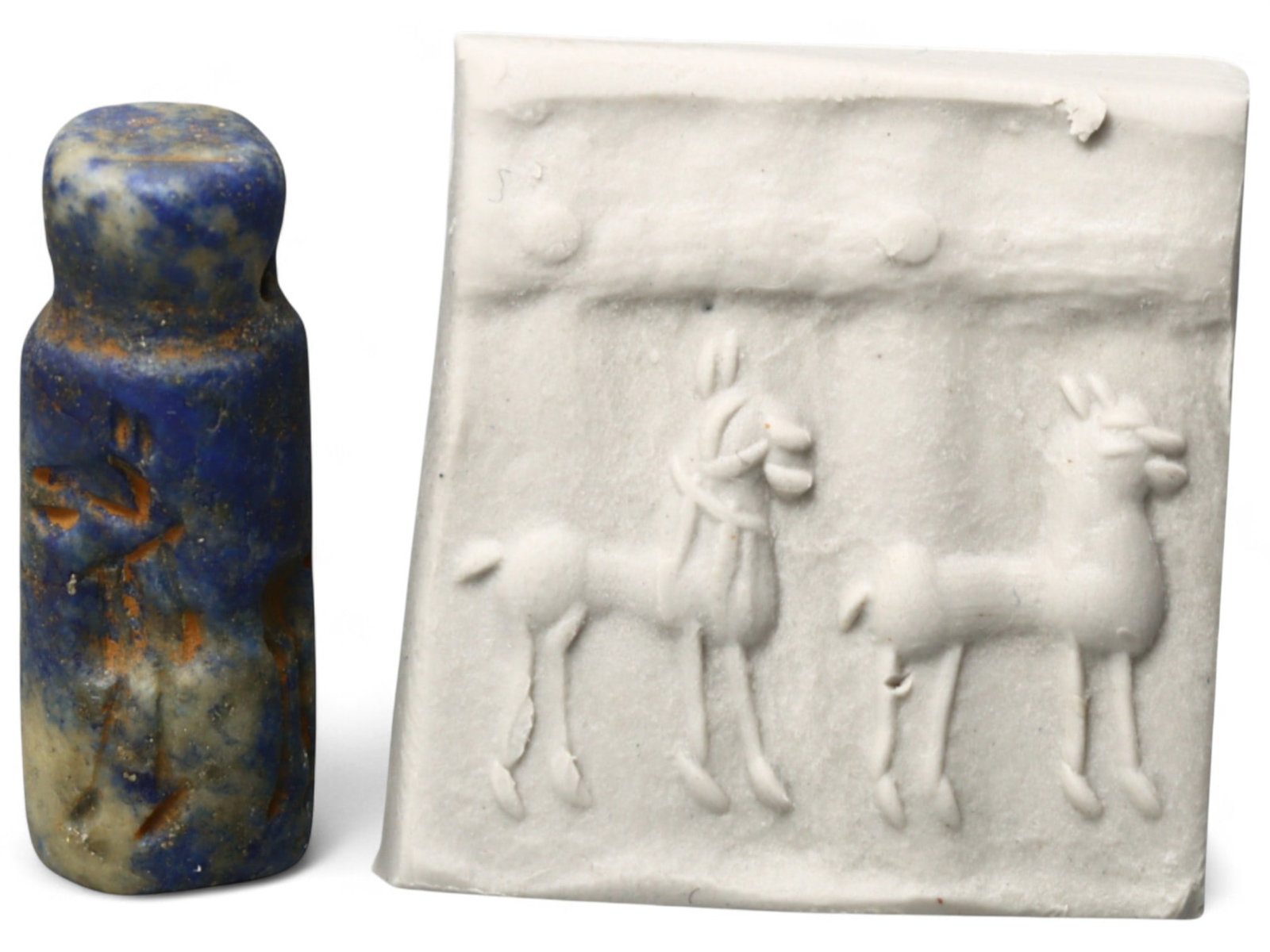 Ancient Akkadian Goat Procession Lapis Lazuli Cylinder Seal, c. 2350-2150 BCE, 5.4g: This beautifully preserved lapis lazuli cylinder seal from the Akkadian Period (c. 2350-2150 BCE) exemplifies the refined artistry of early Mesopotamian glyptic work. Measuring approximately 0.98 inch