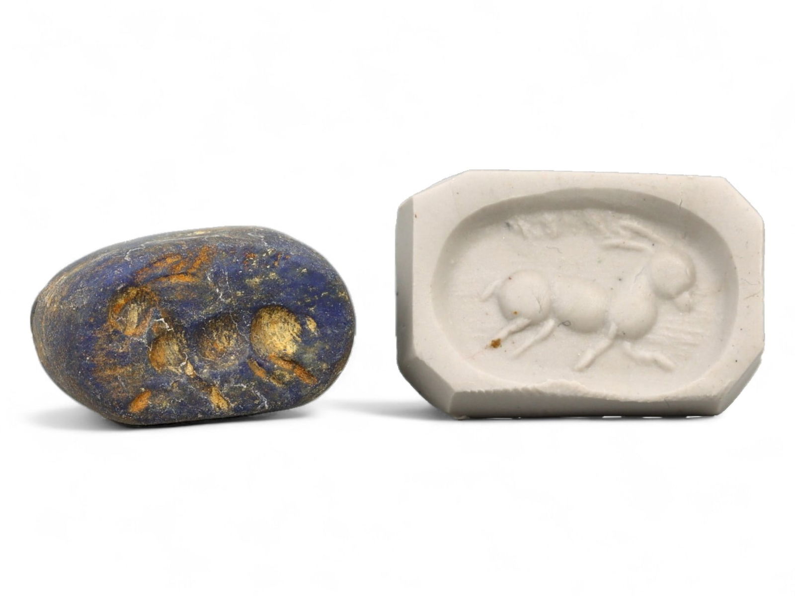 Ancient Elamite Reclining Ibex Oval Lapis Lazuli Stamp Seal, c. 2500-1800 BCE, 7.4g: This finely carved oval stamp seal, crafted from lustrous lapis lazuli, originates from the Elamite civilization and dates to approximately 2500-1800 BCE. As one of the most prominent early Iranian cu