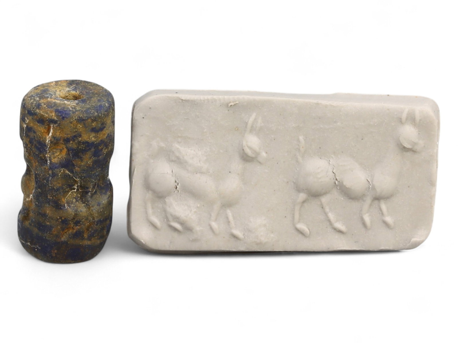 Ancient Elamite Triple Ibex Procession Lapis Lazuli Cylinder Seal, c. 2500-1800 BCE, 6.2g: This ancient Elamite cylinder seal, carved from vibrant lapis lazuli and dating to circa 2500-1800 BCE, captures the serene elegance of animal procession art that flourished in early Bronze Age southw