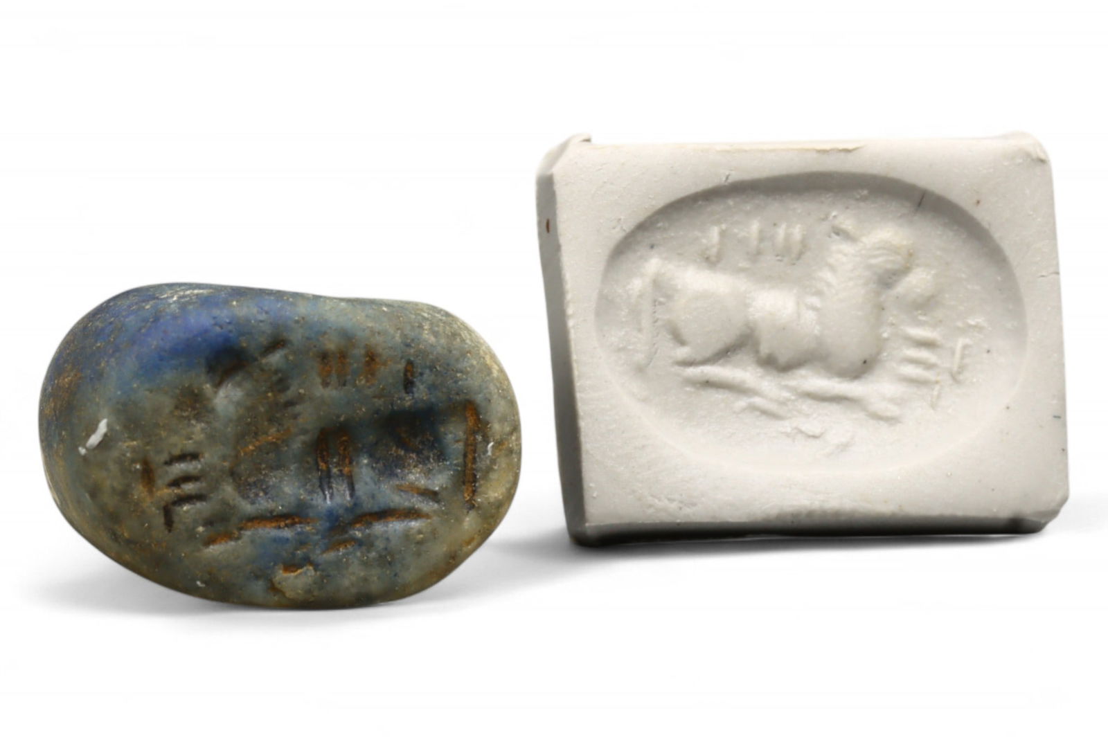 Ancient Ur III Reclining Caprid Linear Symbol Motif Lapis Lazuli Stamp Seal, 2100-2000 BCE, 11.10g: This richly patinated lapis lazuli stamp seal, dated to the Ur III period (c. 2100-2000 BCE), presents a poised reclining caprid, framed by vertical and radiating linear marks. These surrounding strok