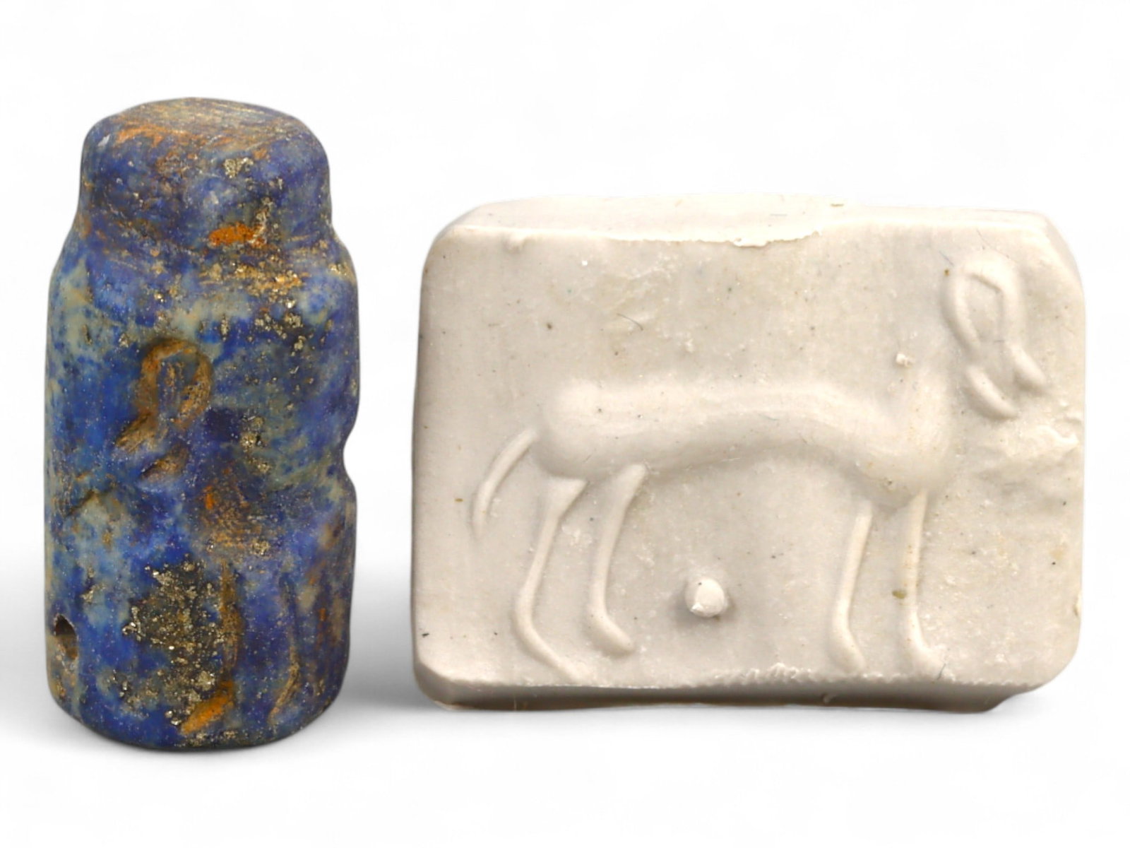 Ancient Elamite Standing Ibex with Ground Marker Lapis Lazuli Cylinder Seal, 2500-1800 BCE, 5.9g: This elegant cylinder seal, carved from deep lapis lazuli during the Elamite period (c. 2500-1800 BCE), features the poised form of a standing ibex, accompanied by a distinct circular ground marker. A