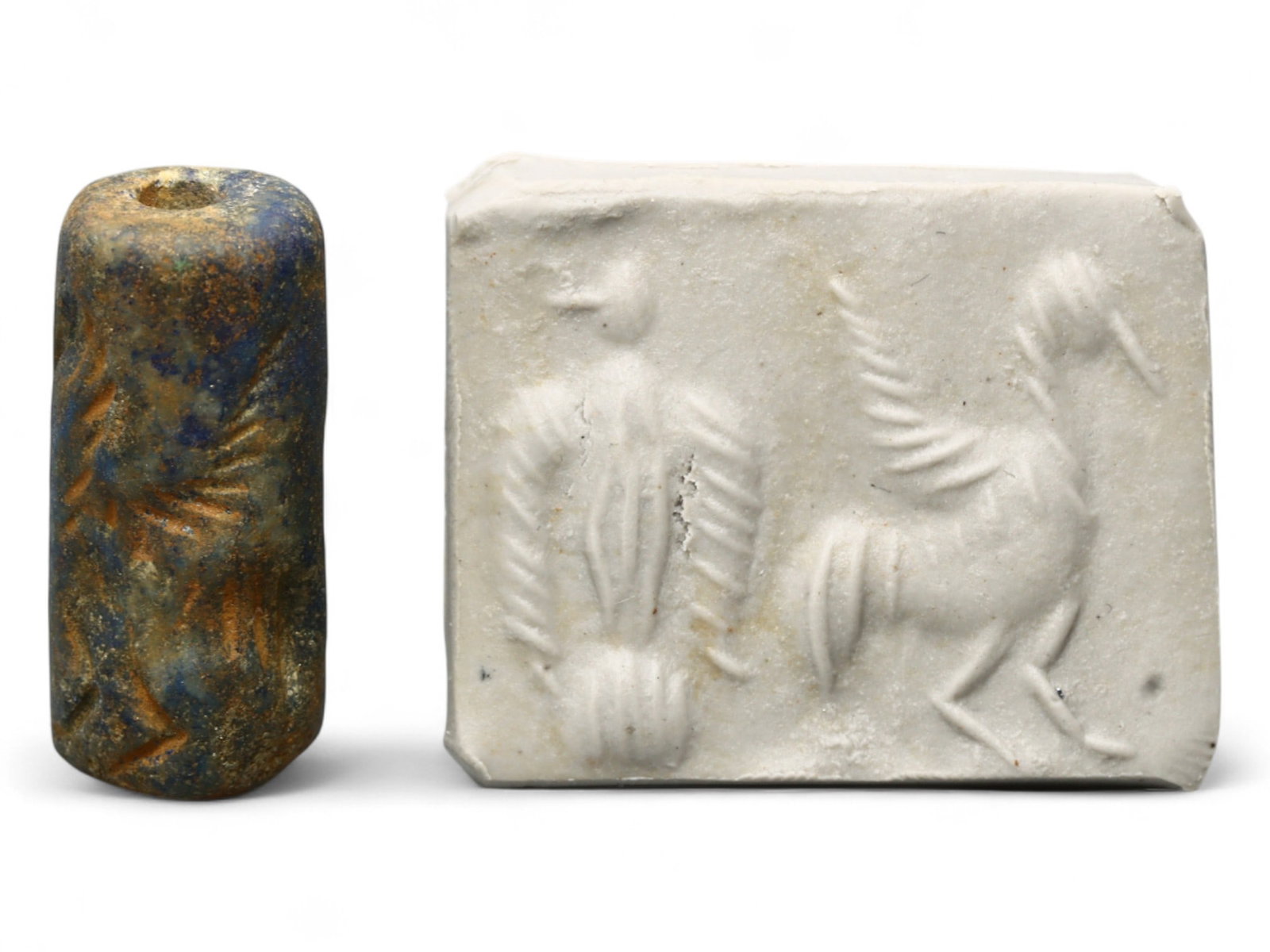Ancient Akkadian Winged Animal Motif Lapis Lazuli Cylinder Seal, c. 2350-2150 BCE, 6.1g: This rare lapis lazuli cylinder seal from the Akkadian Period (c. 2350-2150 BCE) presents a striking depiction of two winged animals, their feathered forms rendered with bold linear incisions. Measuri