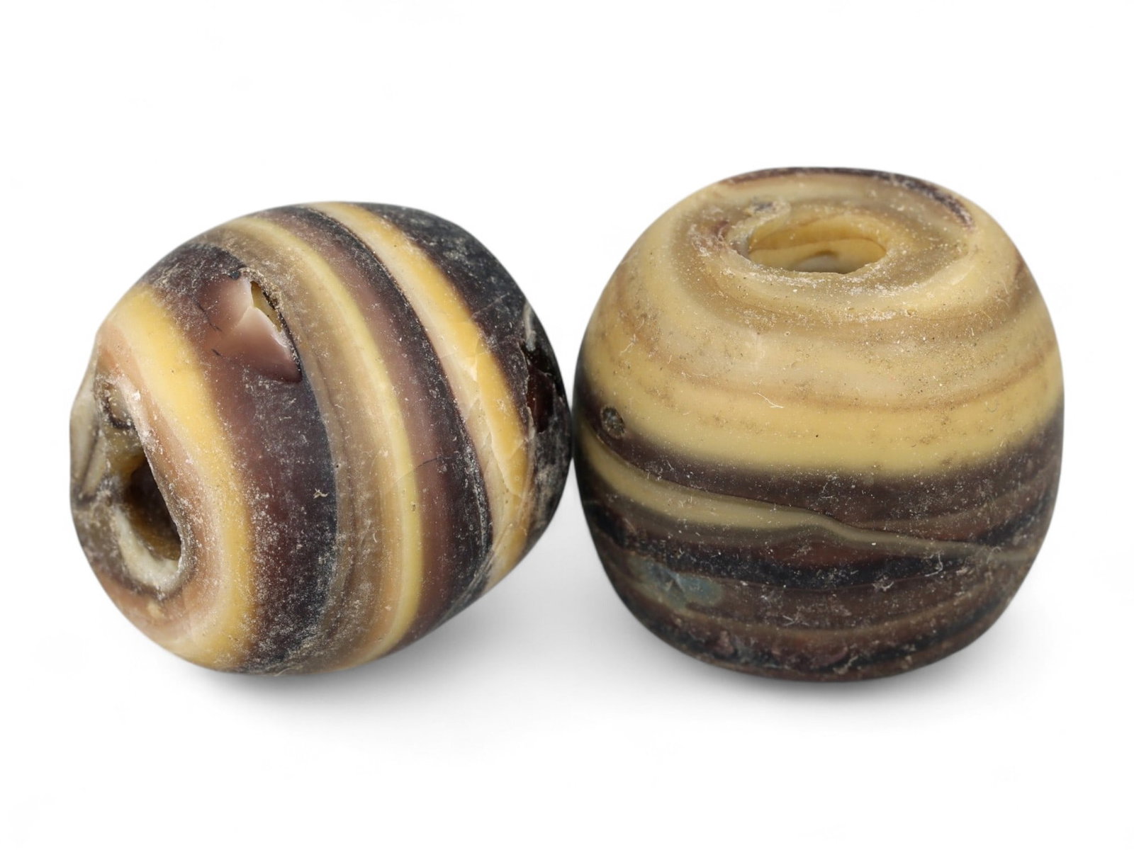 Ancient Persian Swirl Motif Glass Beads Pair, c. 5th-3rd Century BCE, 1.7cm, 17.6g: This exquisite matched pair of ancient Persian swirl glass beads dates to the Achaemenid period, circa 5th to 3rd century BCE-a time when the Persian Empire was at the height of its artistic and cultu