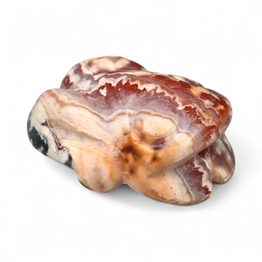 Ancient Egyptian Multicolored Agate Frog Amulet, New Kingdom, c. 1550-1069 BCE, 1.7g: Carved from richly banded agate in hues of red, cream, and black, this small frog amulet, measuring 1.5 x 1.2 cm and weighing 1.7 grams, hails from New Kingdom Egypt (c. 1550-1069 BCE). Frogs in ancie