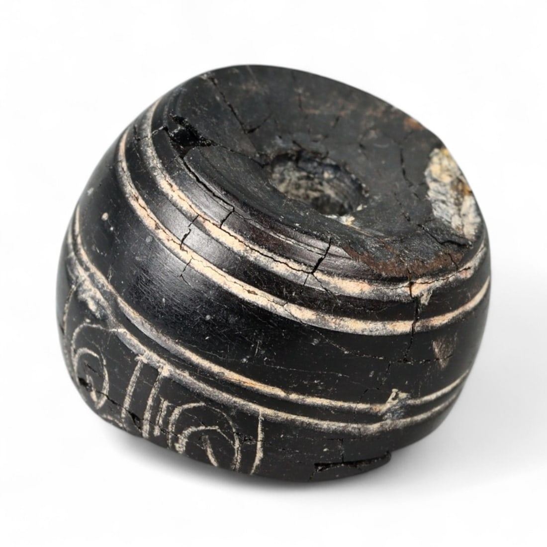 Ancient Mesopotamian Spiraled Jet Barrel Bead Amulet, c. 3rd Millennium BCE - 3.1g: This powerful and elegantly worn artifact is a jet barrel bead from ancient Mesopotamia, likely dating to the Early Dynastic or Akkadian era (c. 2900-2154 BCE). Measuring 1.8 cm in diameter and weighi