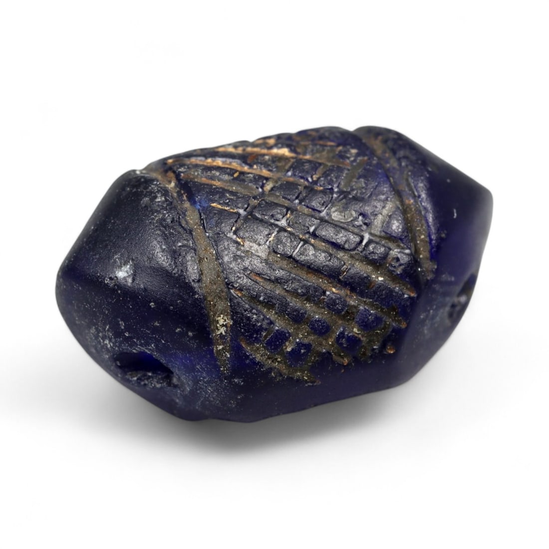 Ancient Roman Crosshatched Blue Glass Amulet Bead, c. 1st-3rd Century CE, 1.8cm, 2.48g: This finely crafted blue glass bead, measuring 1.8 cm in length and weighing 2.48 grams, dates to the Roman Imperial period, approximately the 1st to 3rd century CE. Cast in a vivid cobalt tone, it fe
