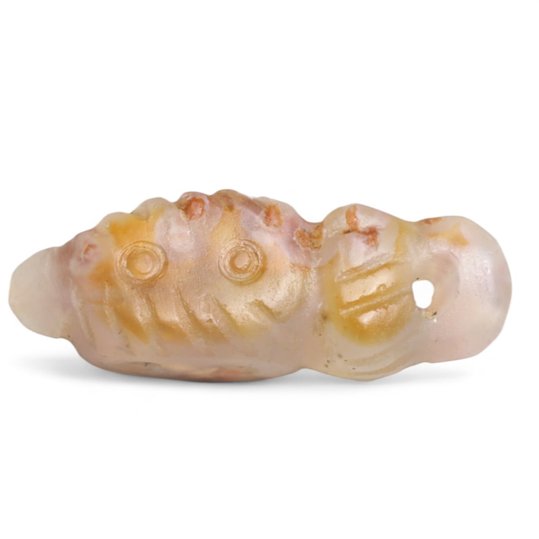 Ancient Coptic Egyptian Chalcedony Silkworm Amulet, c. 5th-7th Century CE, 1.6g: Delicately carved from translucent chalcedony, this miniature amulet in the form of a silkworm or caterpillar measures 2.2 cm in length and weighs 1.6 grams. Originating from Coptic Egypt in the 5th-7