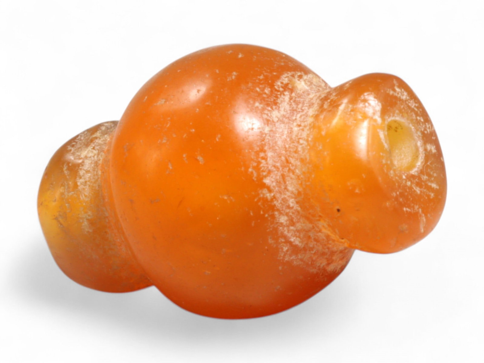 Ancient Medieval Chola Collared Carnelian Trade Bead, c. 9th-13th Century CE, 2cm, 4g: This finely polished carnelian bead, carved in a classic collared form, originates from the powerful Chola Dynasty of South India, a civilization that thrived between the 9th and 13th centuries CE. Th