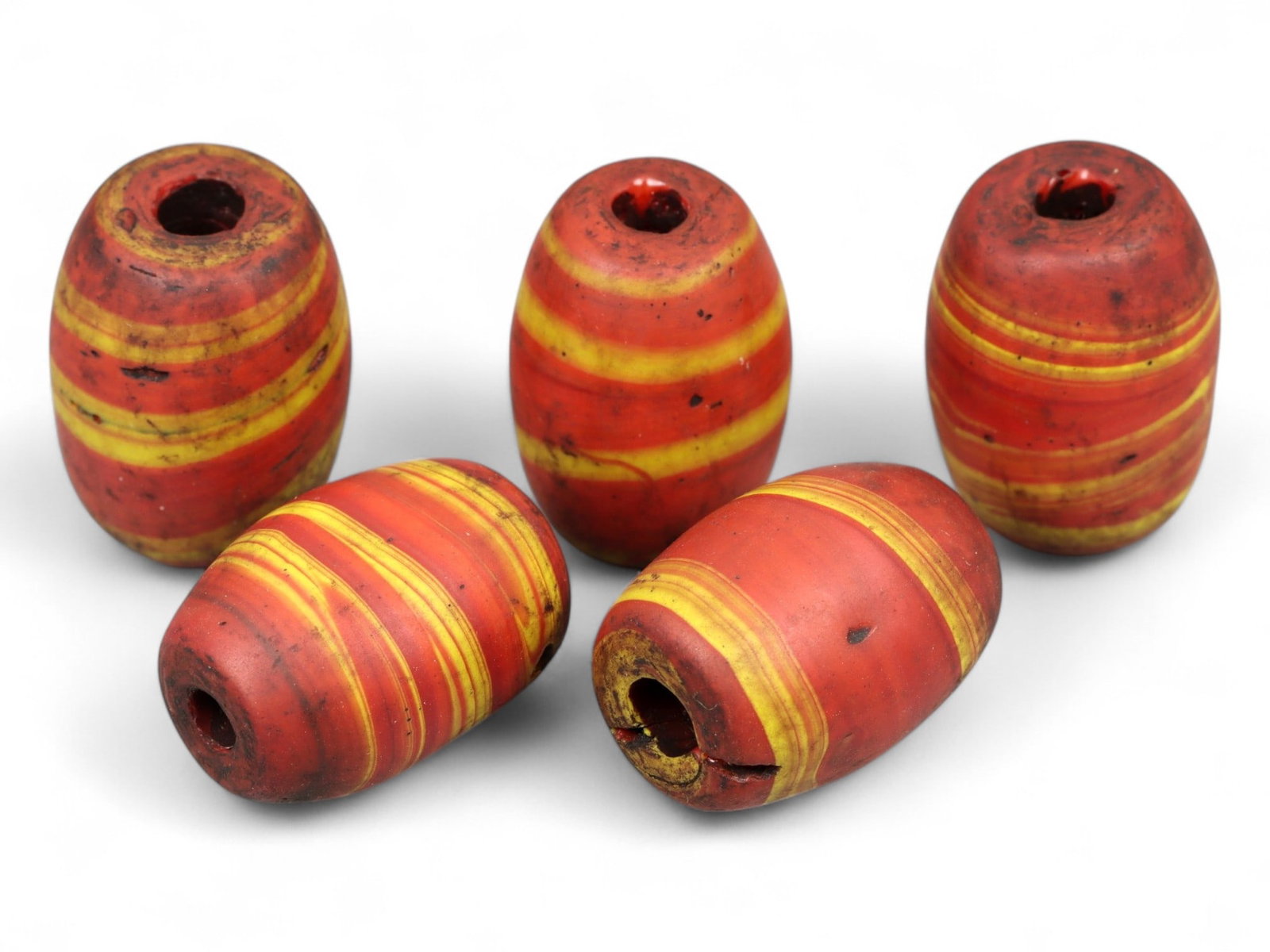 Ancient Medieval Islamic Striped Red-Yellow Glass Beads, c. 9th-13th Century CE, 2cm, 36g: This captivating set of five striped glass beads showcases the vibrant artistry of the medieval Islamic world during the height of the Abbasid to early Mamluk periods. Measuring approximately 2 cm eac