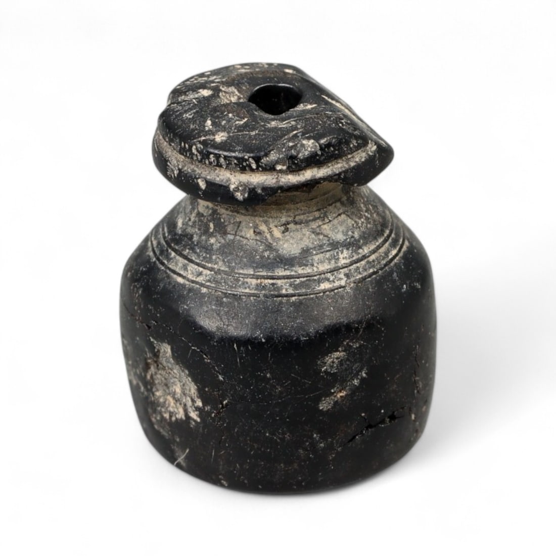 Ancient Mesopotamian Ritual Jet Eye Bead Amulet, c. 3rd Millennium BCE - 1.5g: Carved from deep black jet and polished to a soft sheen, this ancient bead likely hails from the Early Dynastic or Akkadian period of Mesopotamia (c. 2900-2154 BCE), a region and era renowned for its 