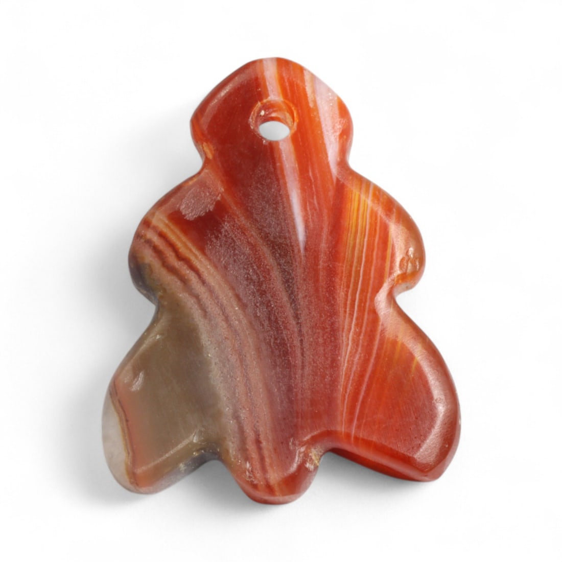 Ancient Coptic Egyptian Carnelian Leaf-Shaped Amulet, c. 5th-7th Century CE, 1.98g: Carved from vivid banded carnelian, this finely shaped Coptic amulet in the form of a stylized leaf or possibly a fig measures 2.2 cm in height and weighs 1.98 grams. Its delicate curves and high poli