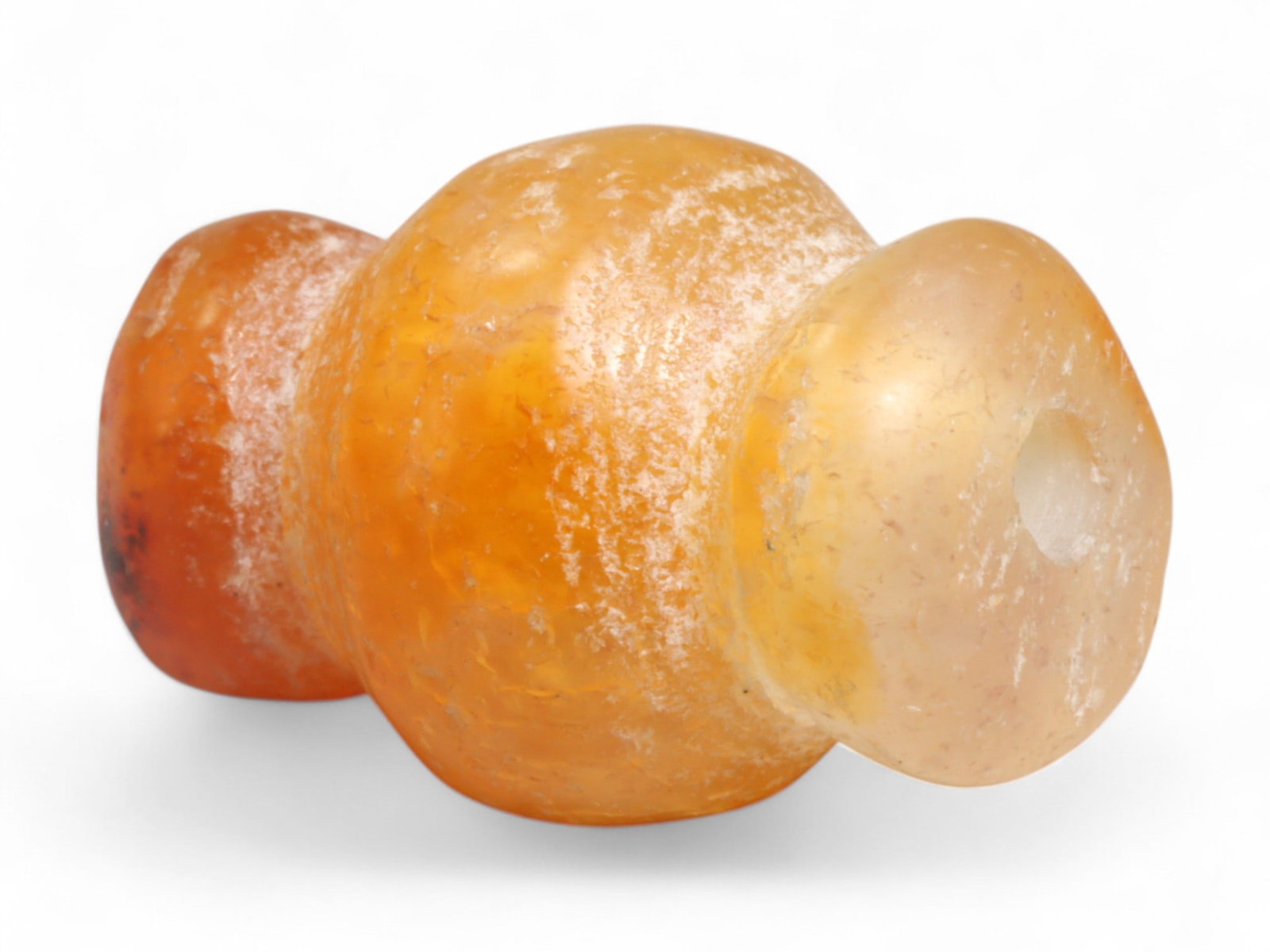 Ancient Medieval Chola Collared Carnelian Trade Bead, c. 9th-13th Century CE, 2cm, 4g: This finely polished carnelian bead, carved in a classic collared form, originates from the powerful Chola Dynasty of South India, a civilization that thrived between the 9th and 13th centuries CE. Th