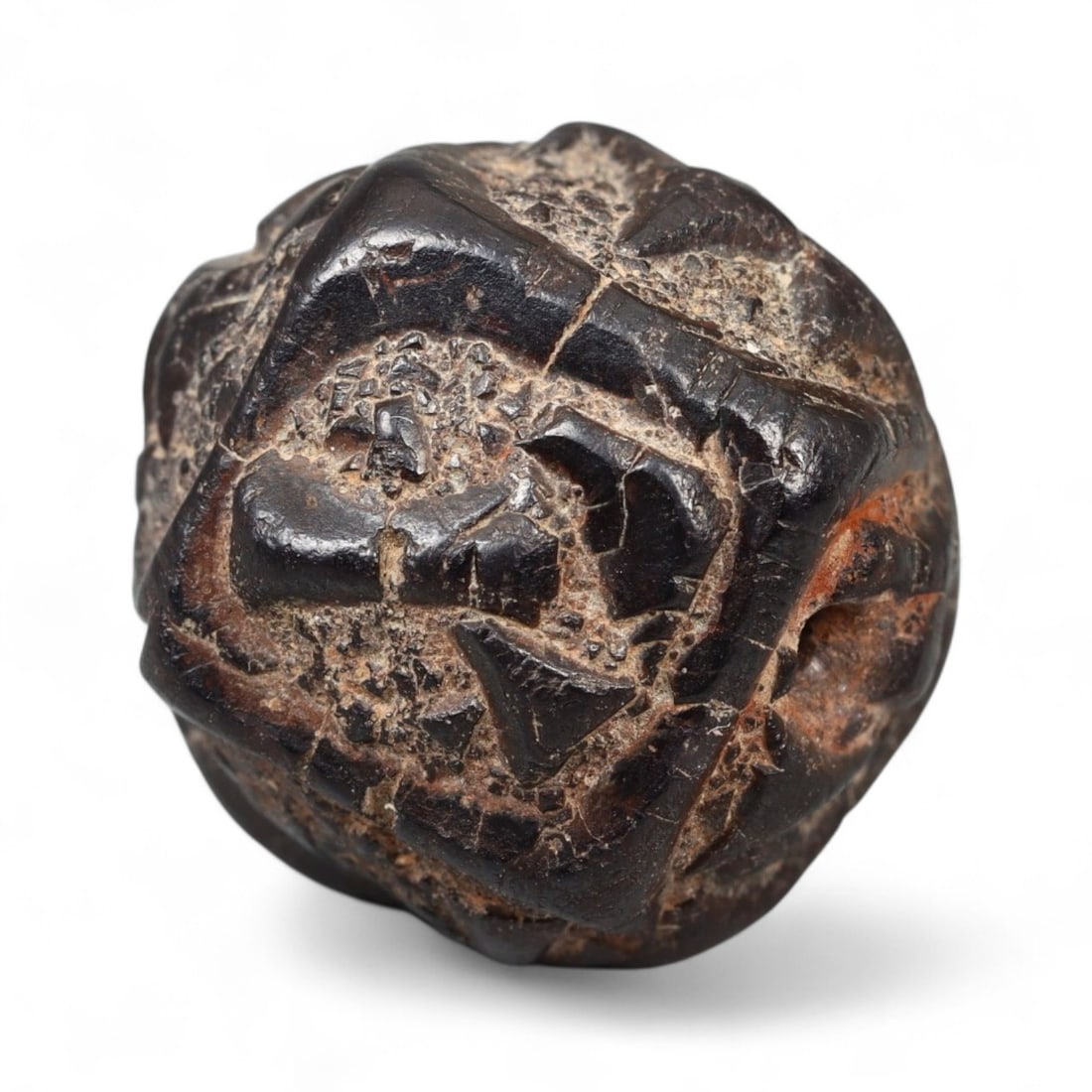 Ancient Near Eastern Cuneiform-Style Carved Stone Bead, c. 2nd-1st Millennium BCE, 1.8cm, 11.2g: This dark brown to black stone bead, measuring 1.8 cm and weighing 11.2 grams, features an intricate and unusually bold geometric surface design that bears strong stylistic parallels to Mesopotamian c