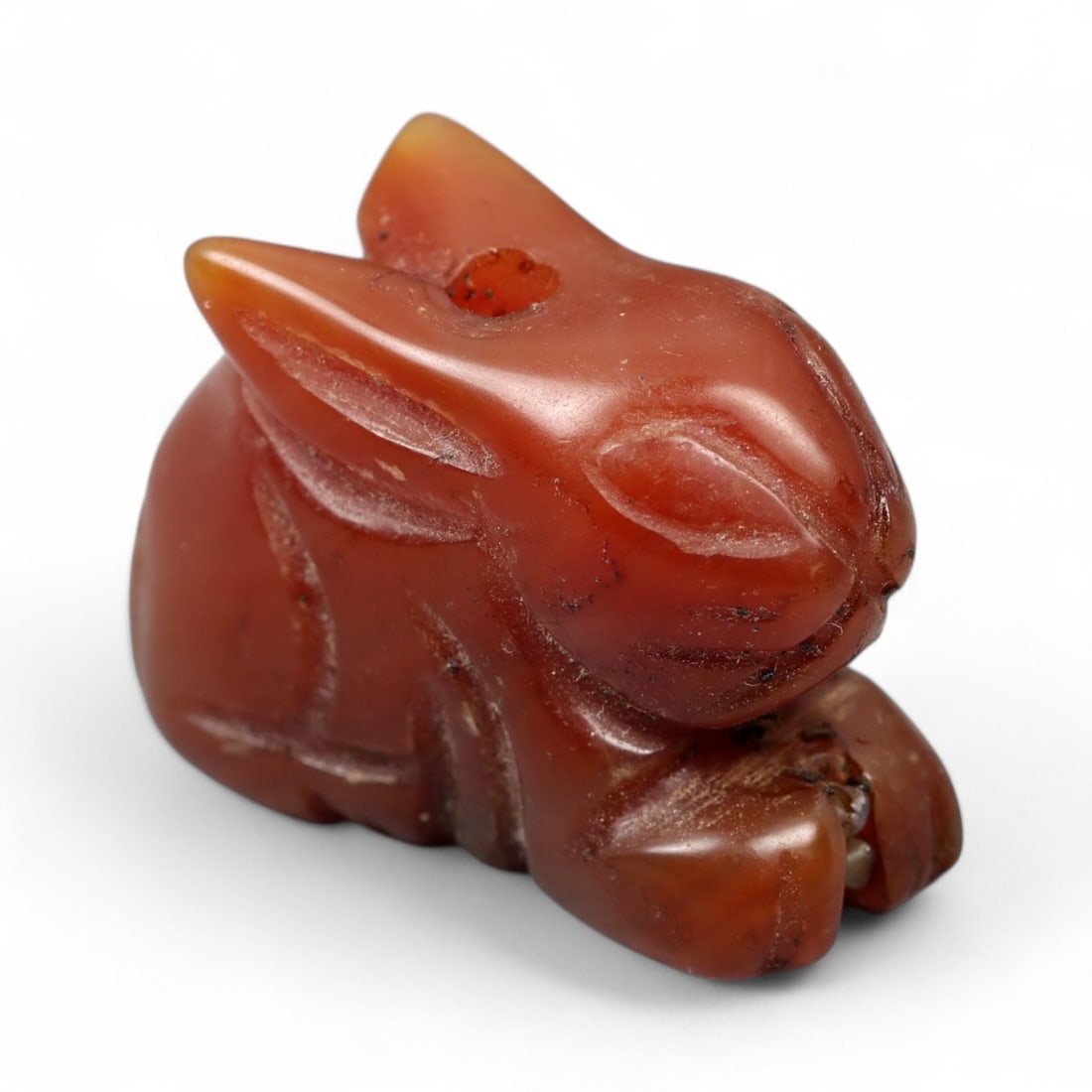 Ancient Coptic Egyptian Rabbit Symbolic Carnelian Amulet, c. 4th-7th Century CE, 5.9g: This finely carved carnelian amulet, shaped in the form of a crouching rabbit, originates from the spiritual and artistic heart of Coptic Egypt during Late Antiquity, c. 4th-7th century CE. Measuring 