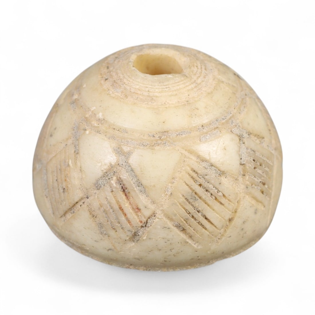 Ancient Indus Valley Geometric Lattice Pattern Bone Spindle Whorl, c. 2600-1900 BCE, 1.9cm, 5.5g: This exceptional spindle whorl, carved from creamy bone and adorned with finely incised geometric motifs, originates from the mature phase of the Indus Valley Civilization-one of the world's earliest 