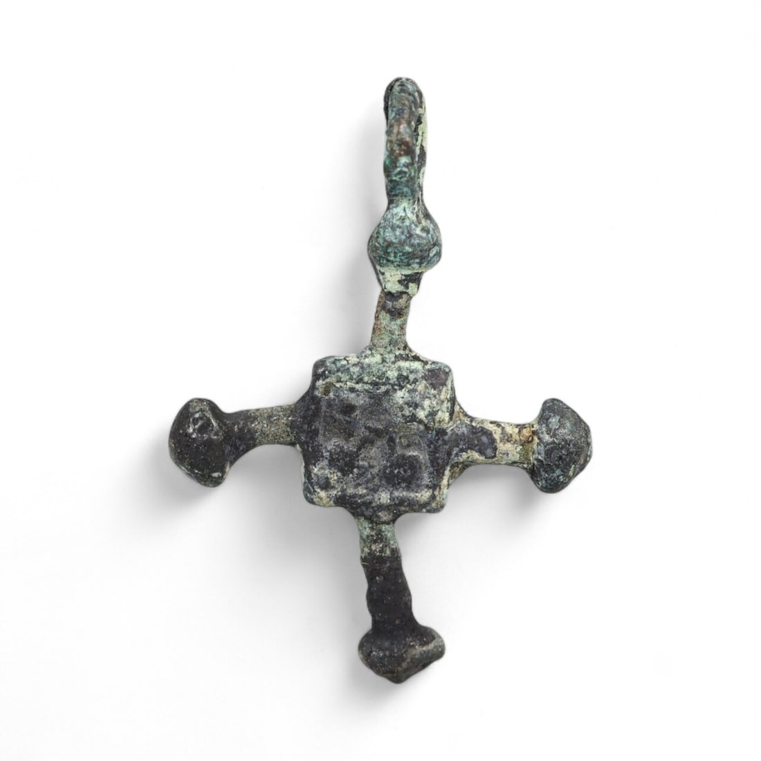 Ancient Kievan Rus Radiant Arm Cross Bronze Pendant, c. 10th-12th Century CE, 0.9g: This finely crafted bronze cross pendant, discovered in Ukraine, hails from the dynamic period of the Kievan Rus between the 10th and 12th centuries CE. Its form exemplifies early Orthodox Christian s