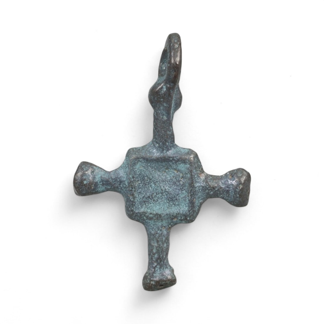 Ancient Kievan Rus Radiant-Form Bronze Cross Pendant, c. 10th-12th Century CE, 1g: This refined bronze cross pendant from the Kievan Rus era dates to the 10th-12th centuries CE and exemplifies the stylistic evolution of Christian devotional objects in early Eastern Europe. Found in