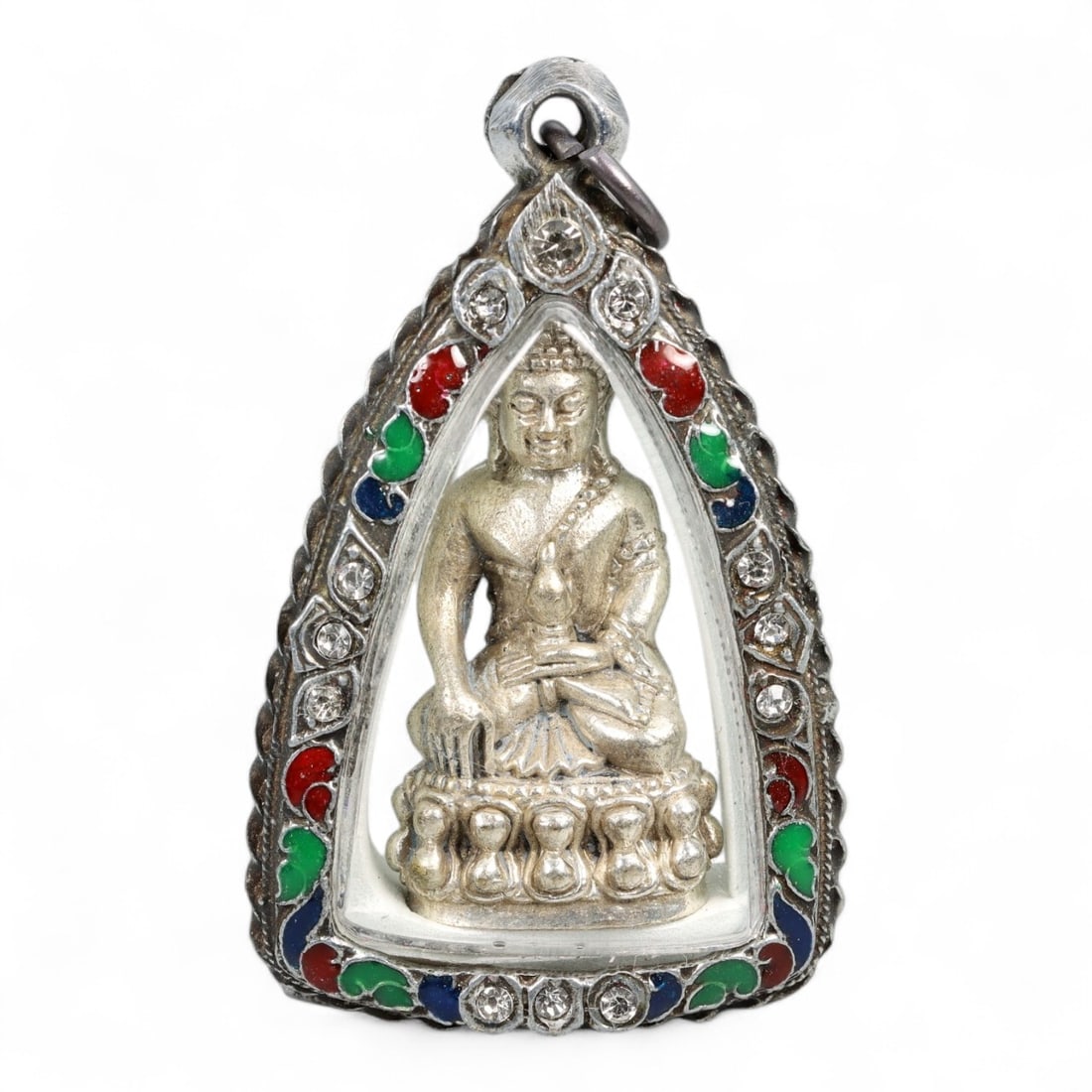 Vintage Thai Silver-Tone Seated Buddha Amulet in Rhinestone Enamel Case, c. Mid-20th Century, 60g: This elegant vintage Thai amulet presents a full-figure Buddha in striking detail, seated upon a double-lotus throne - a symbol of transcendence and spiritual purity in Theravada Buddhism. Rendered in