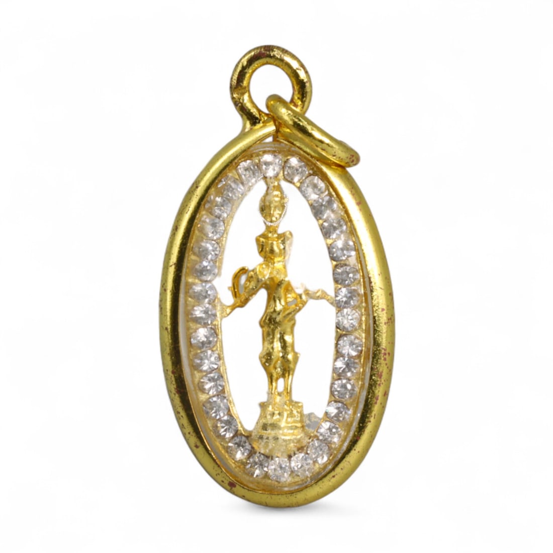 Indo-Himalayan Vishnu Avatar Standing Deity Oval Gold-Tone Amulet Pendant, Modern Era, 2.4g: This refined and openwork oval pendant showcases a golden standing deity - likely an avatar of Vishnu or a celestial guardian - framed within a halo of sparkling crystal accents. Set in a polished gol