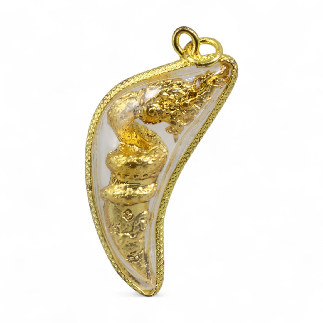 Thai Naga Fang-Form Amulet with Gilt Serpent in Curved Transparent Casing, Modern Era, 15g: This dramatic Thai amulet features a sinuous Naga serpent coiled along the inner curve of a fang-shaped form, rendered in brilliant gold-toned relief. Measuring 4.7x2 cm and weighing 15 grams, the amu