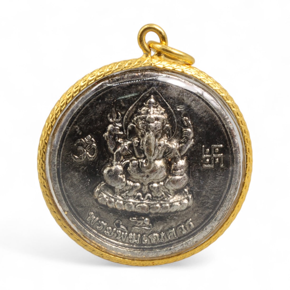 Thai Ganesha and Yaksha Dual Relief Amulet in Silver-Tone Medallion, Modern Era, 21g: This powerful Thai amulet presents Ganesha and a crowned Yaksha guardian in striking dual relief, cast in polished silver-tone metal and framed in a gold-toned rope-edged casing. Measuring 4x3.7 cm an