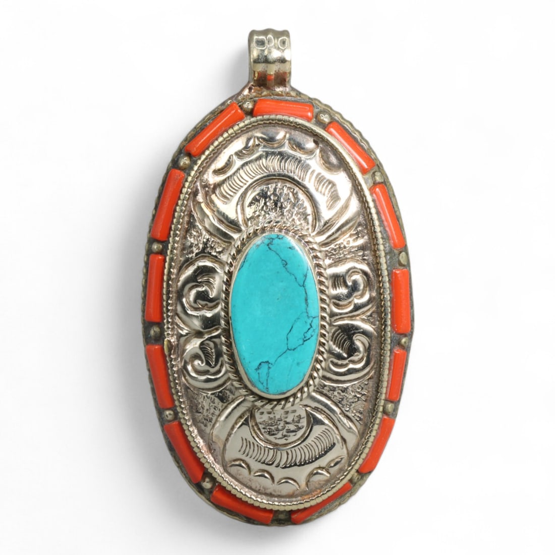 Tibetan Oval Turquoise Coral Border Silver Pendant Necklace, Himalayas Origin, 52g: Rich in symbolism and visual harmony, this Tibetan pendant features a prominent oval turquoise stone encased in a finely chased silver setting. Surrounding the turquoise, intricate repousse patterns e