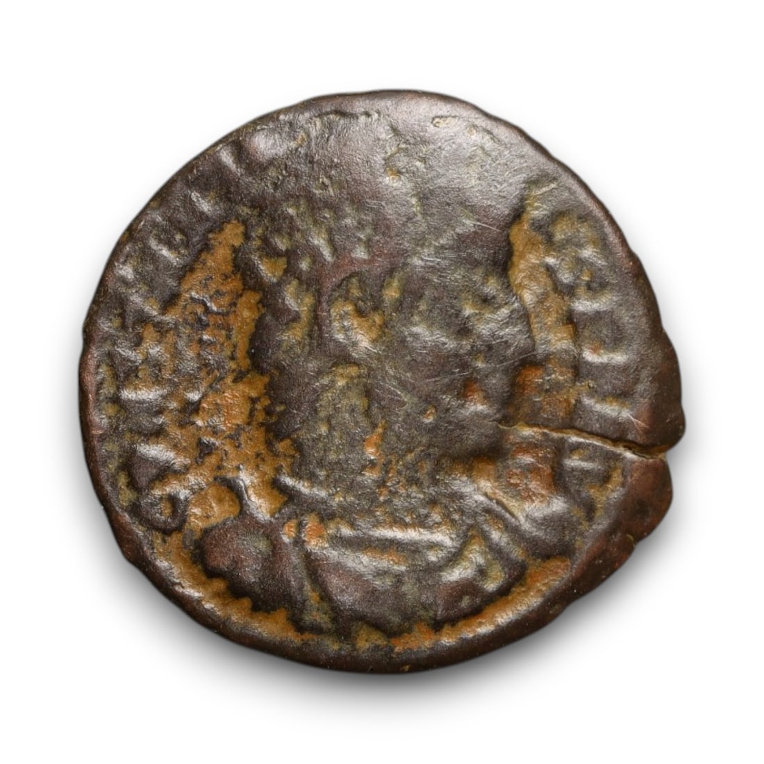 ROMAN EMPIRE: Imperial Authority - Bronze Coin, c. 1st-3rd Century AD, 15mm: Struck during the turbulent decades of the later Roman Empire, this 19mm bronze coin reflects the enduring symbolism of imperial control amidst crisis. Its compact yet deliberate design likely feature