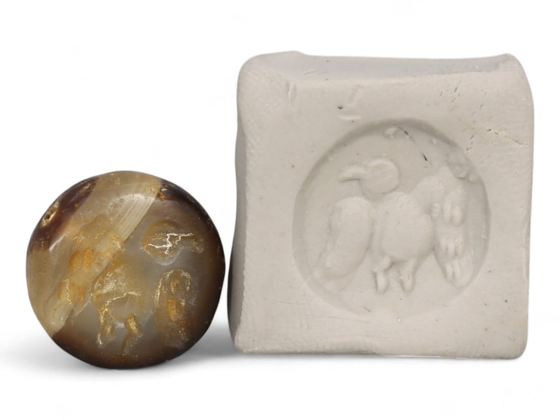 Ancient Near Eastern Hemispherical Carnelian Stamp Seal of Vultures, c. 2nd Millennium BCE, 2.8g: This miniature yet striking stamp seal from the ancient Near East dates to the 2nd millennium BCE, a period when seals served both as personal identifiers and sacred amulets. Expertly carved from tran
