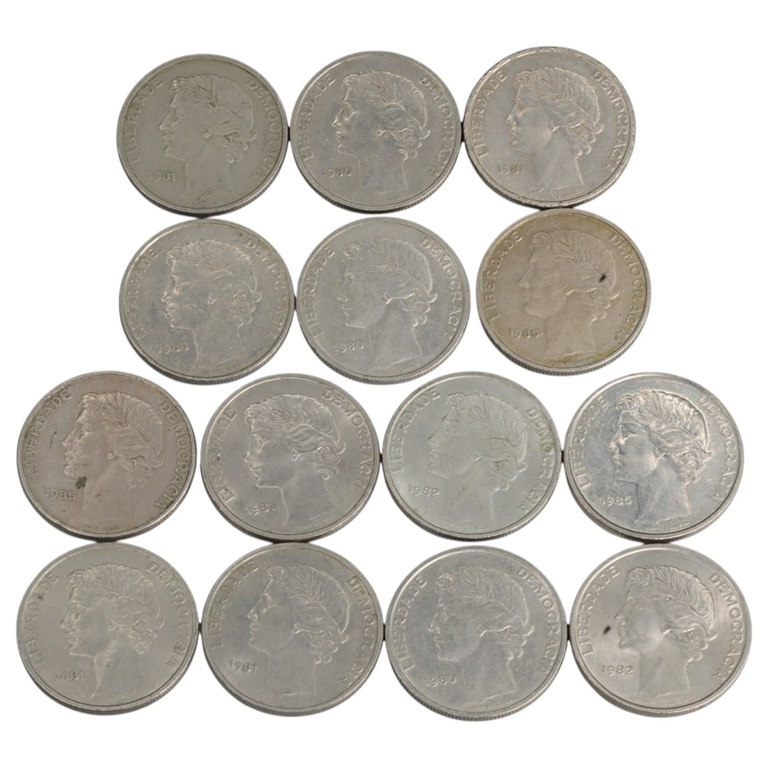 PORTUGAL: Third Republic - Liberty & Democracy 25 Escudos Coin Group, 1980-1991, 25mm (14 Coins): Struck in the wake of Portugal's 1974 Carnation Revolution and its peaceful transition from dictatorship to democracy, this group of fourteen 25 Escudos coins embodies the ideological rebirth of the P
