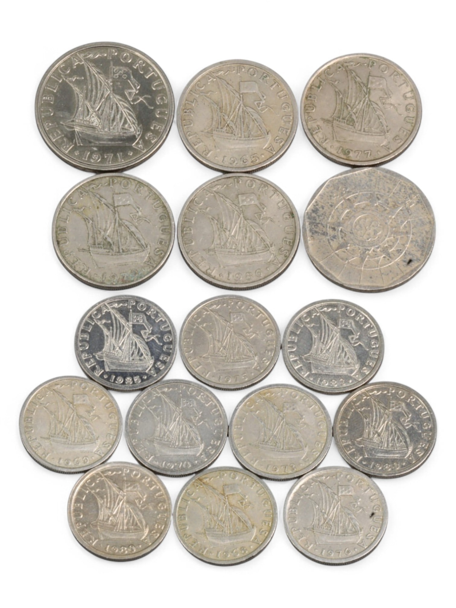 PORTUGAL: Maritime Heritage & Republican Stability - Escudo Era Coin Lot, 1965-1990s: This 16-coin lot from the Portuguese Escudo era elegantly merges the nation's seafaring legacy with modern republican symbolism. On one side, classic issues depict the famed caravela, Portugal's iconi
