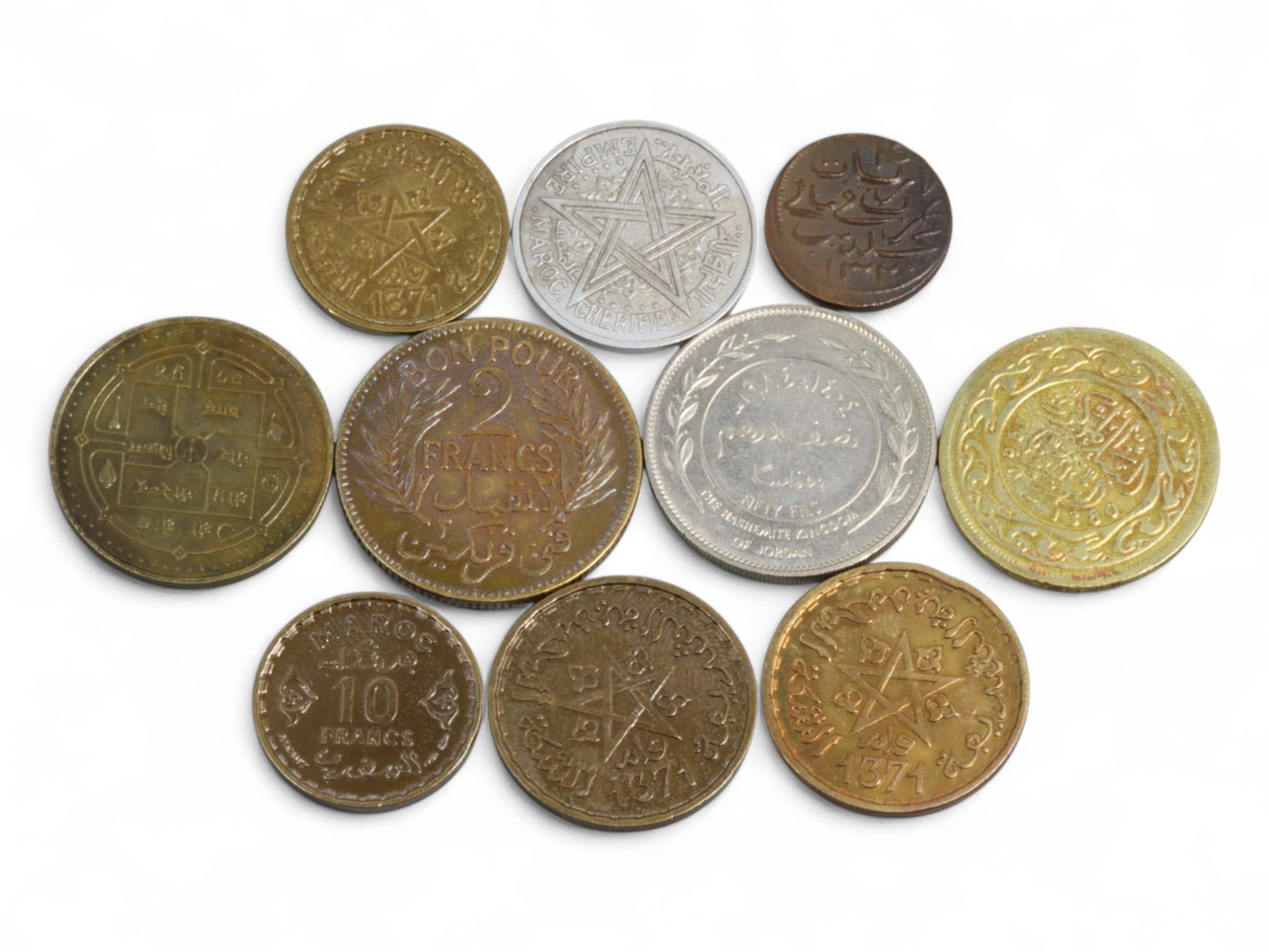 MOROCCO/TUNISIA/ARAB STATES: North African Franc & Fils Coin Lot, 20th Century, 15-25mm: This 10-coin lot highlights the numismatic artistry of North Africa and the broader Arab world in the mid- to late 20th century, where currency became a key vehicle for asserting postcolonial sovereig