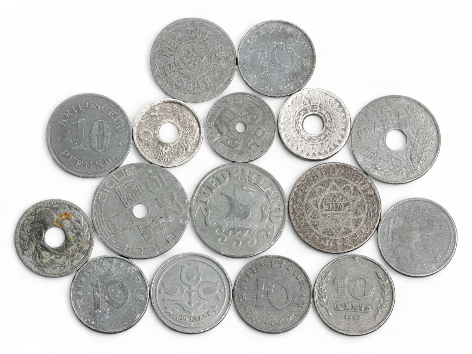 EUROPE & COLONIES: Wartime Economies - Mixed 10 Centimes/Pfennig Coins, 1915-1955, 20-25mm: A vivid mosaic of 20th-century European monetary history, this 16-coin lot captures the tension, resilience, and adaptation of wartime and postwar economies through a range of 10-centime and 10-pfenni