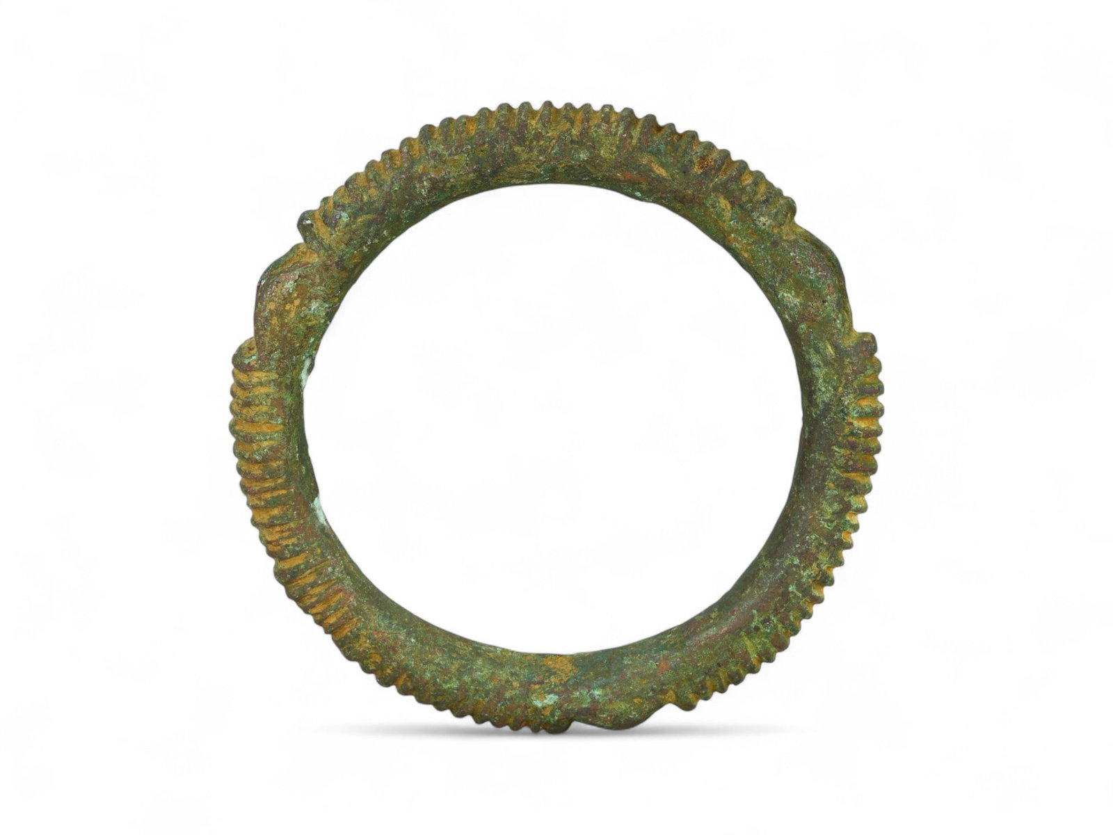 Ancient West African Ridged Bronze Ringform Prestige Bracelet, c. 1st Millennium BCE-CE, 115g: This powerful ancient bracelet, cast in solid bronze and measuring 7.5 cm in diameter, is a striking example of early West African metallurgical skill and symbolic design. Weighing 115 grams, it featu