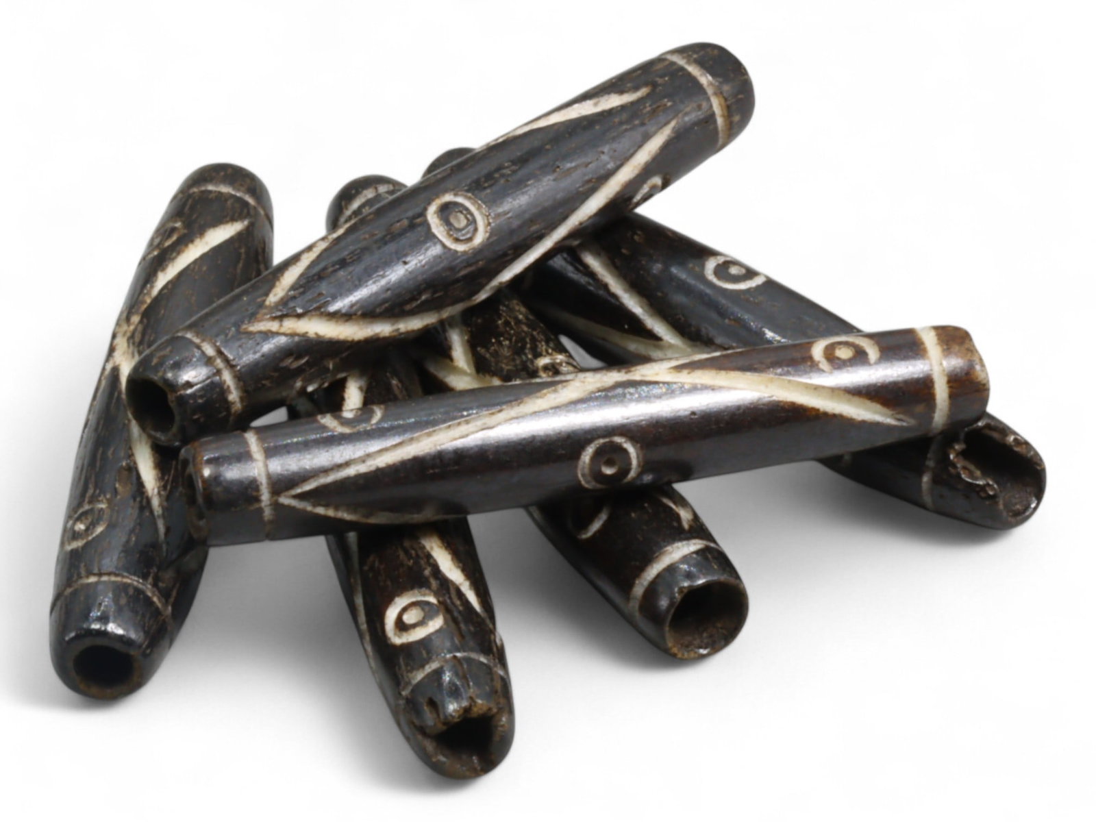 Vintage Tibetan Yak Bone Bead, Double-Eye and X-Motif Amulet Cylinder, c. Mid-20th Century, 10g: This vintage Tibetan yak bone bead features the iconic double-eye motif enclosed within X-shaped geometric lines-an arrangement echoing spiritual protection, unity, and focused intention. Crafted in t
