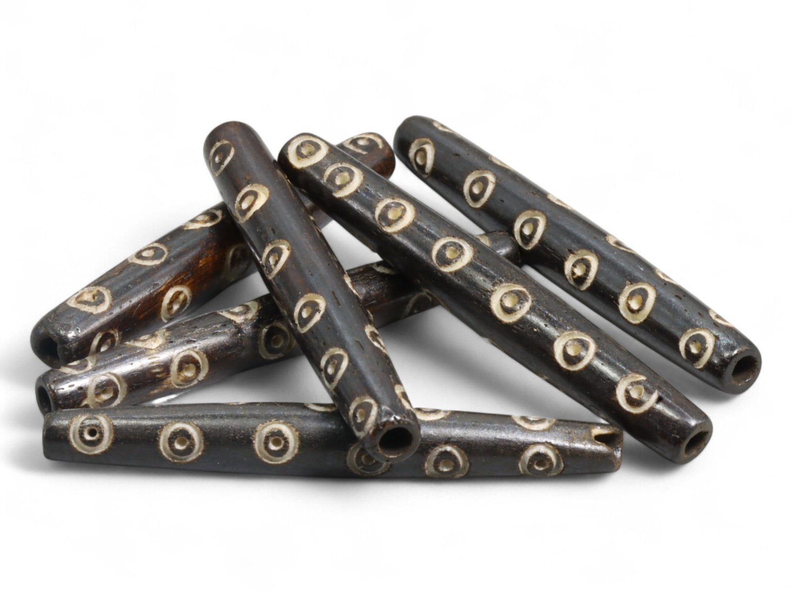 Vintage Tibetan Protective Eye Motif Bone Bead Amulet, c. Mid-20th Century, 15g: This vintage Tibetan bone bead, engraved with a repeating series of eye motifs, is a striking example of mid-20th century Himalayan protective symbolism. Each meticulously carved eye is believed to se