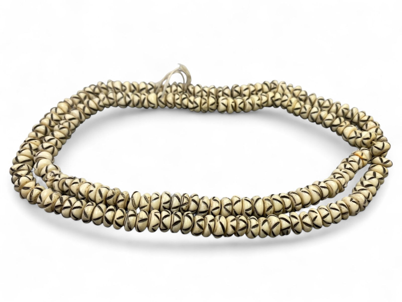 Vintage Tibetan Ethnic Motif Yak Bone Beads Strand, Unstrung, c. 20th Century, 50g: This vintage strand of Tibetan yak bone beads reflects a rich Himalayan aesthetic rooted in ritual, spiritual symbolism, and artisan tradition. While not ancient or antique, these unstrung beads captu